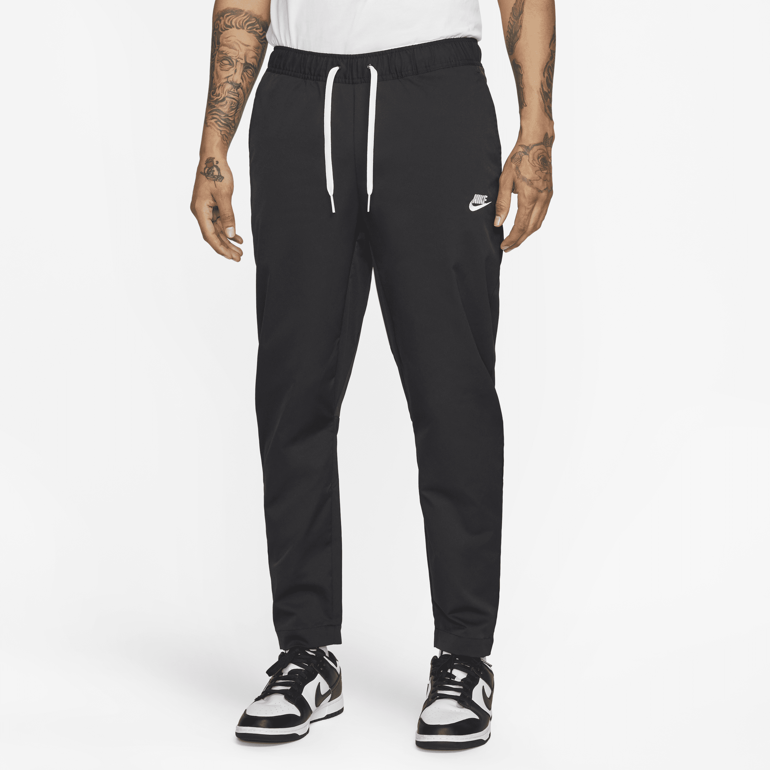 Shop Nike Men's Club Woven Tapered Leg Pants In Black
