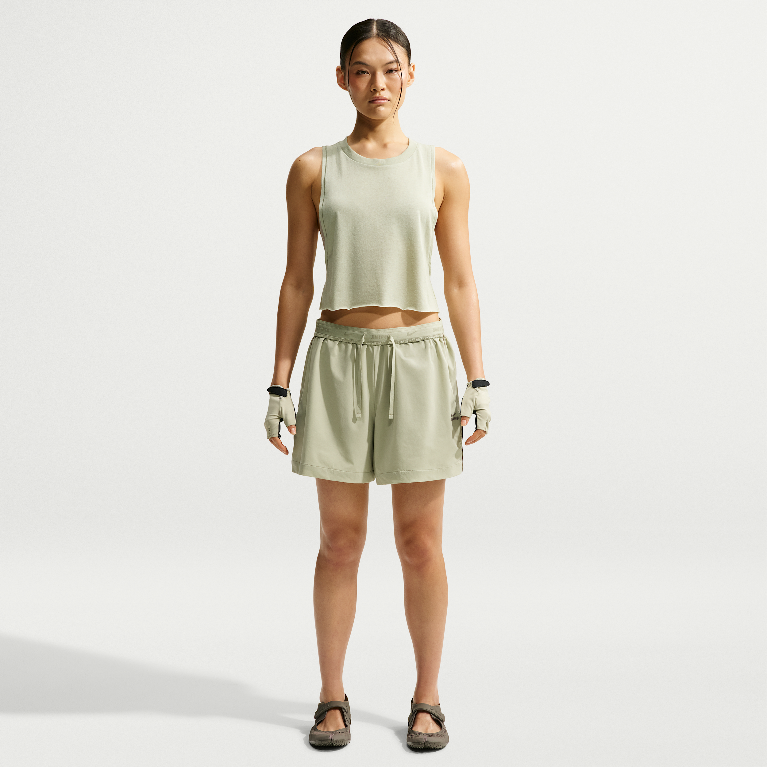 Nike Women's SKIMS Stretch Nylon 5" Track Shorts in Green | IU2227-379