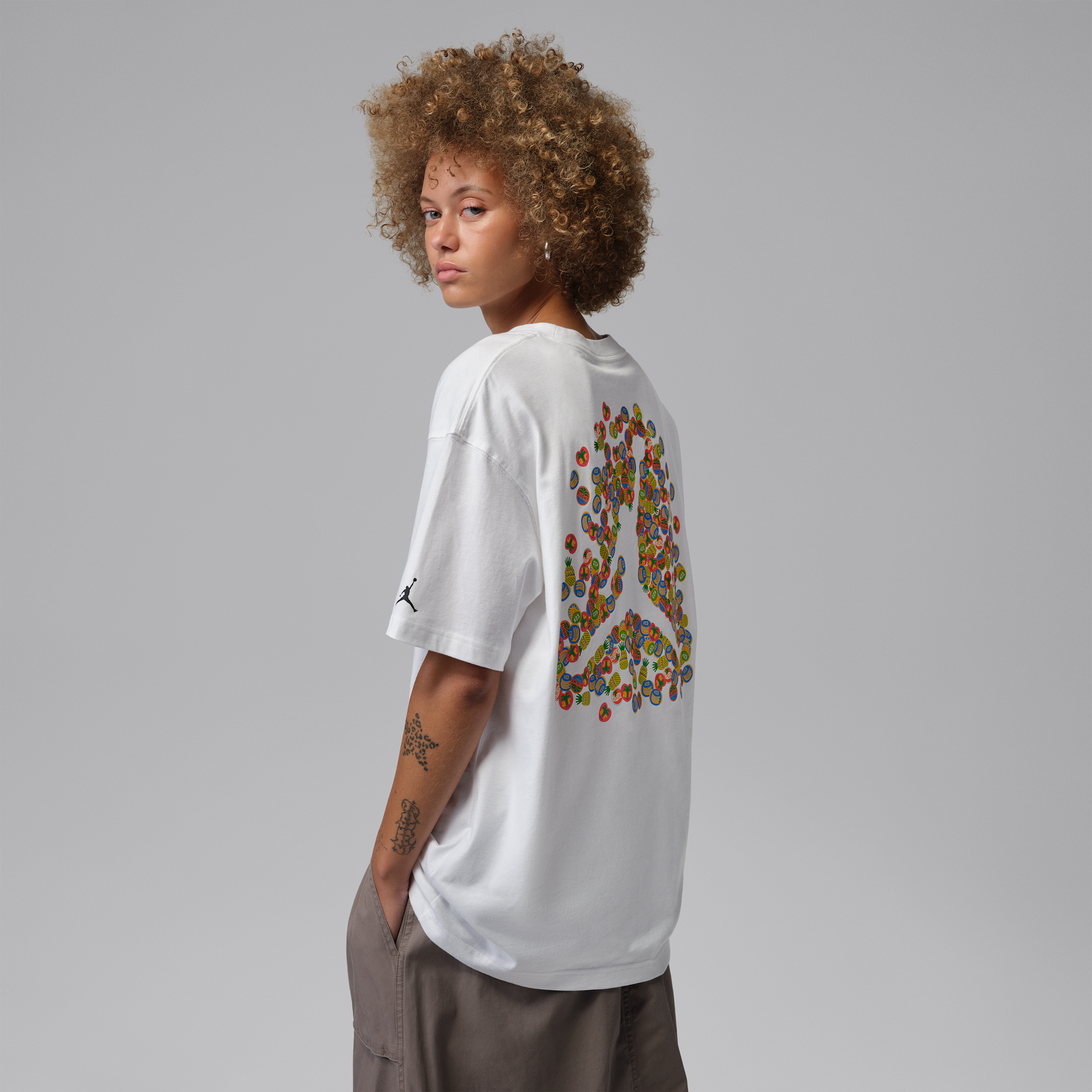 Jordan Women's Brooklyn Fruit Oversized Graphic T-Shirt in White/Black Size: Medium