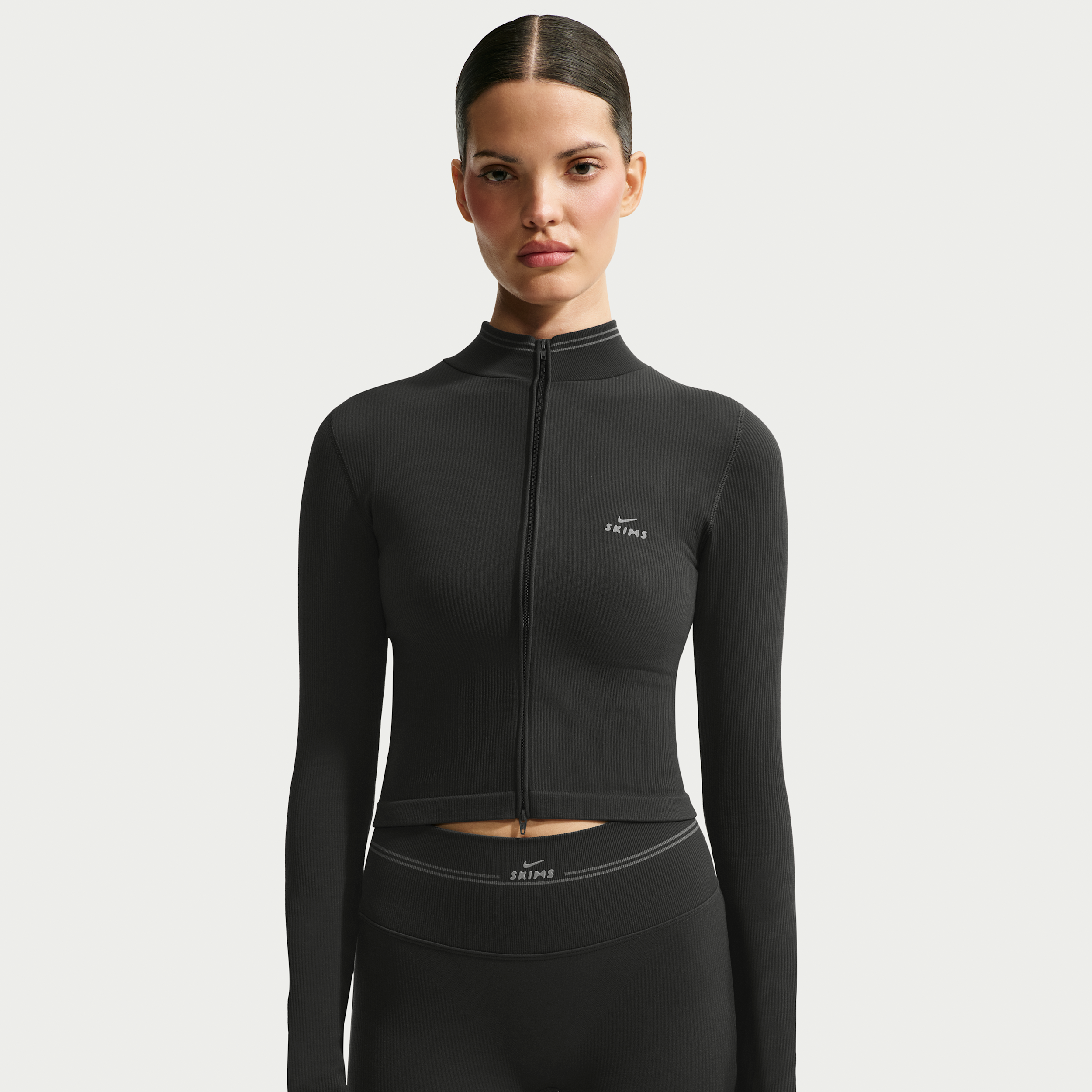 Nike Women's SKIMS Ribbed Seamless Cropped Full-Zip Jacket in Black | IR5149-054