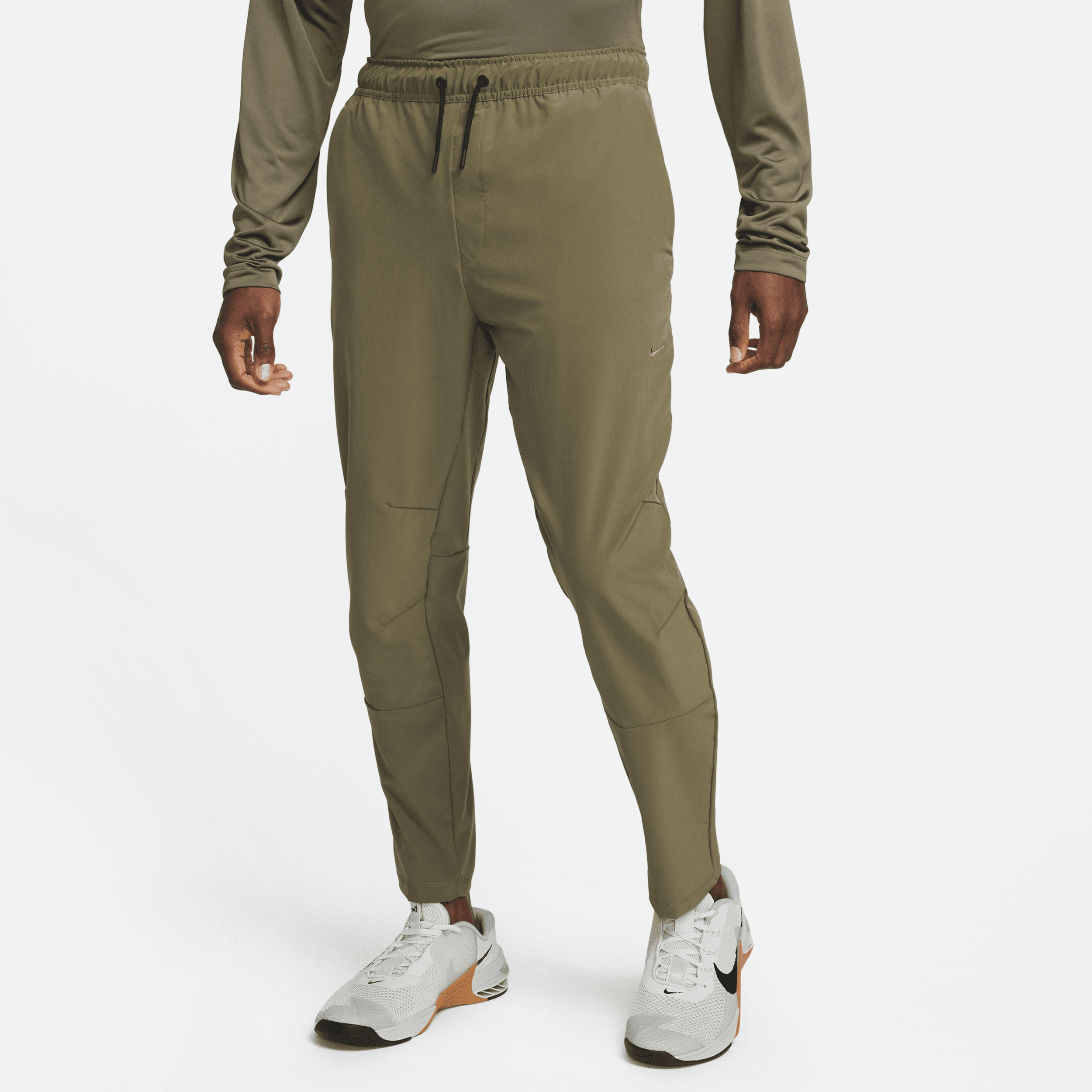 Shop Nike Men's Unlimited Dri-fit Tapered Leg Versatile Pants In Green