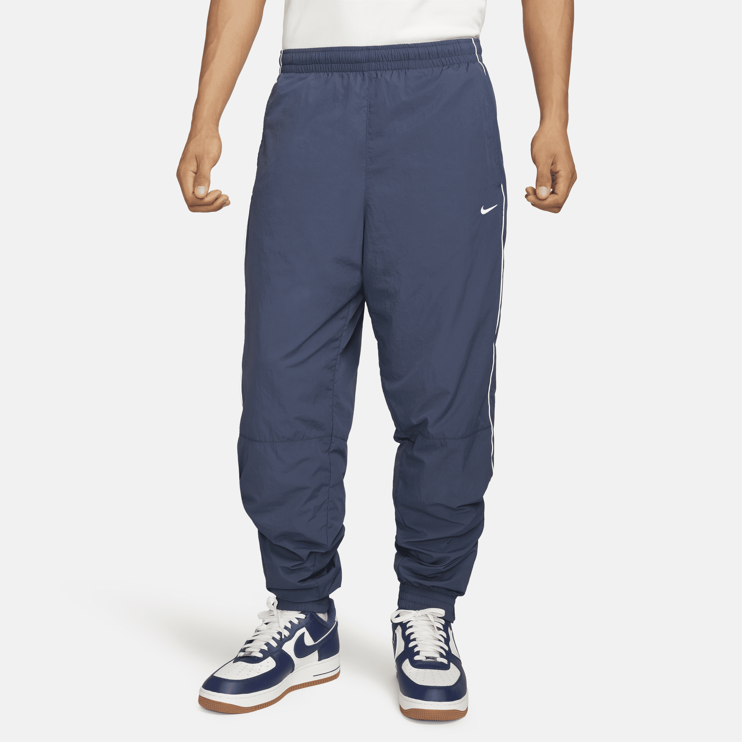 Nike Solo Swoosh Water Repellent Track Pants In Blue
