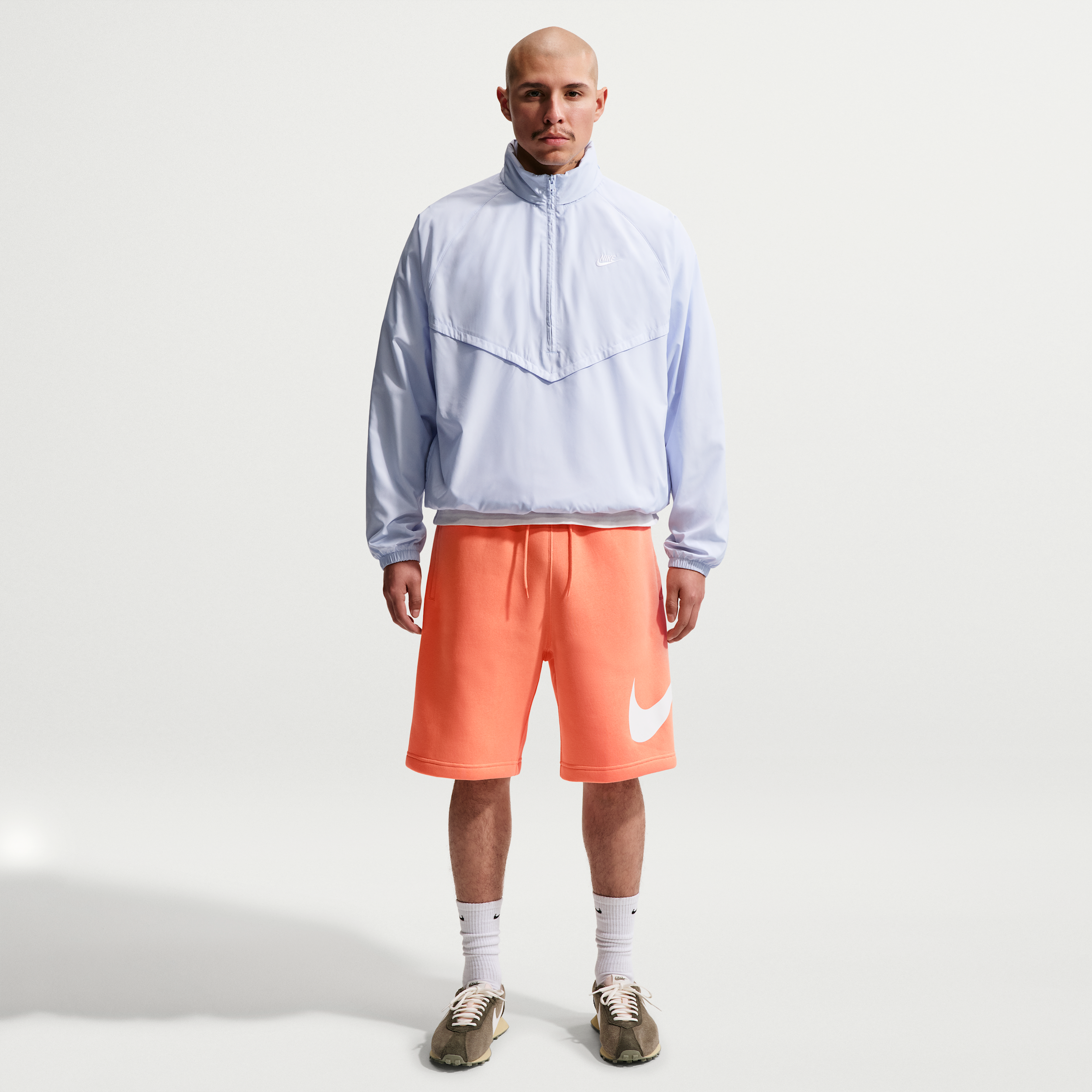 Nike Men's Club Fleece Swoosh Graphic Shorts in Orange Frost/Orange Frost/White Size: XL