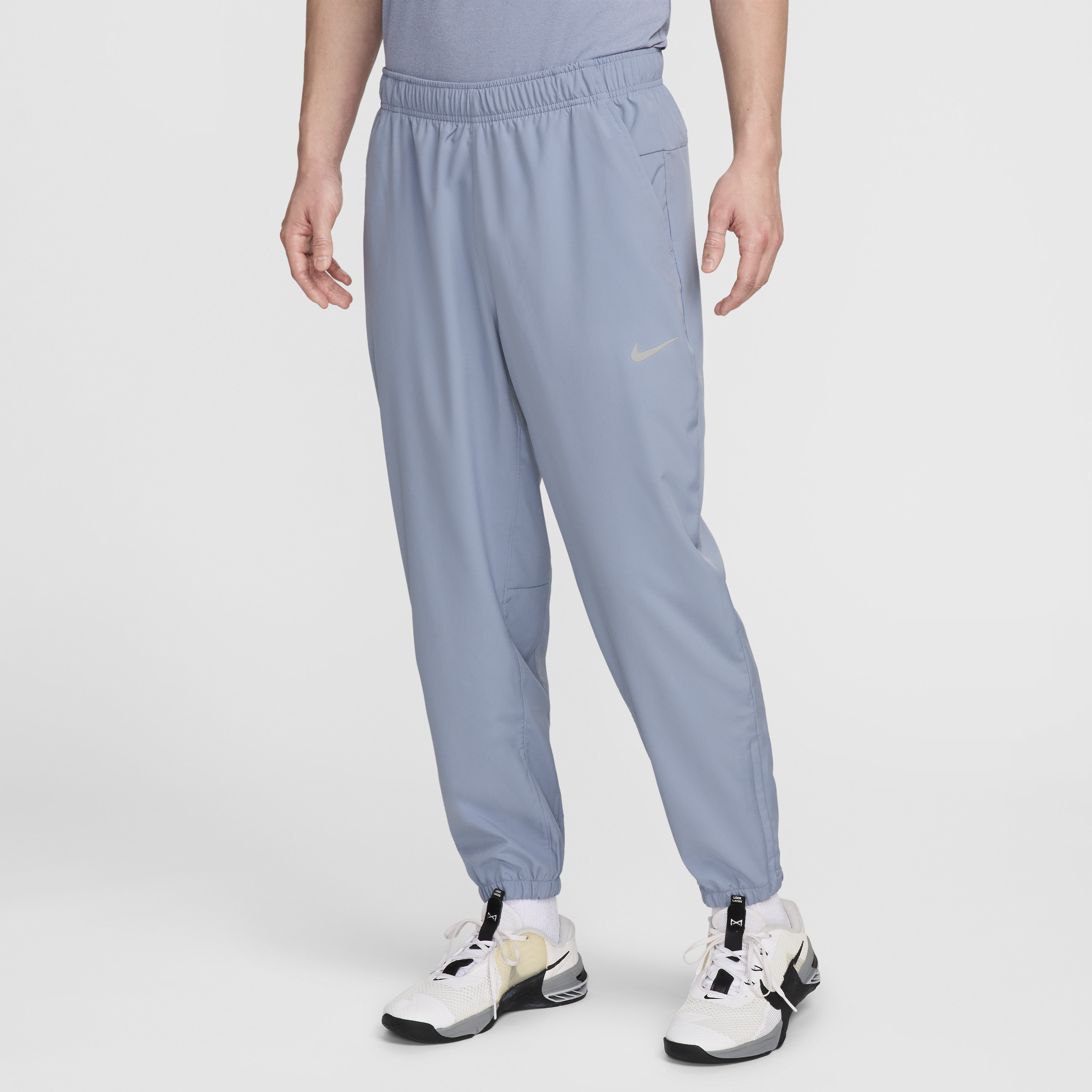 Shop Nike Men's Form Dri-fit Tapered Versatile Pants In Blue