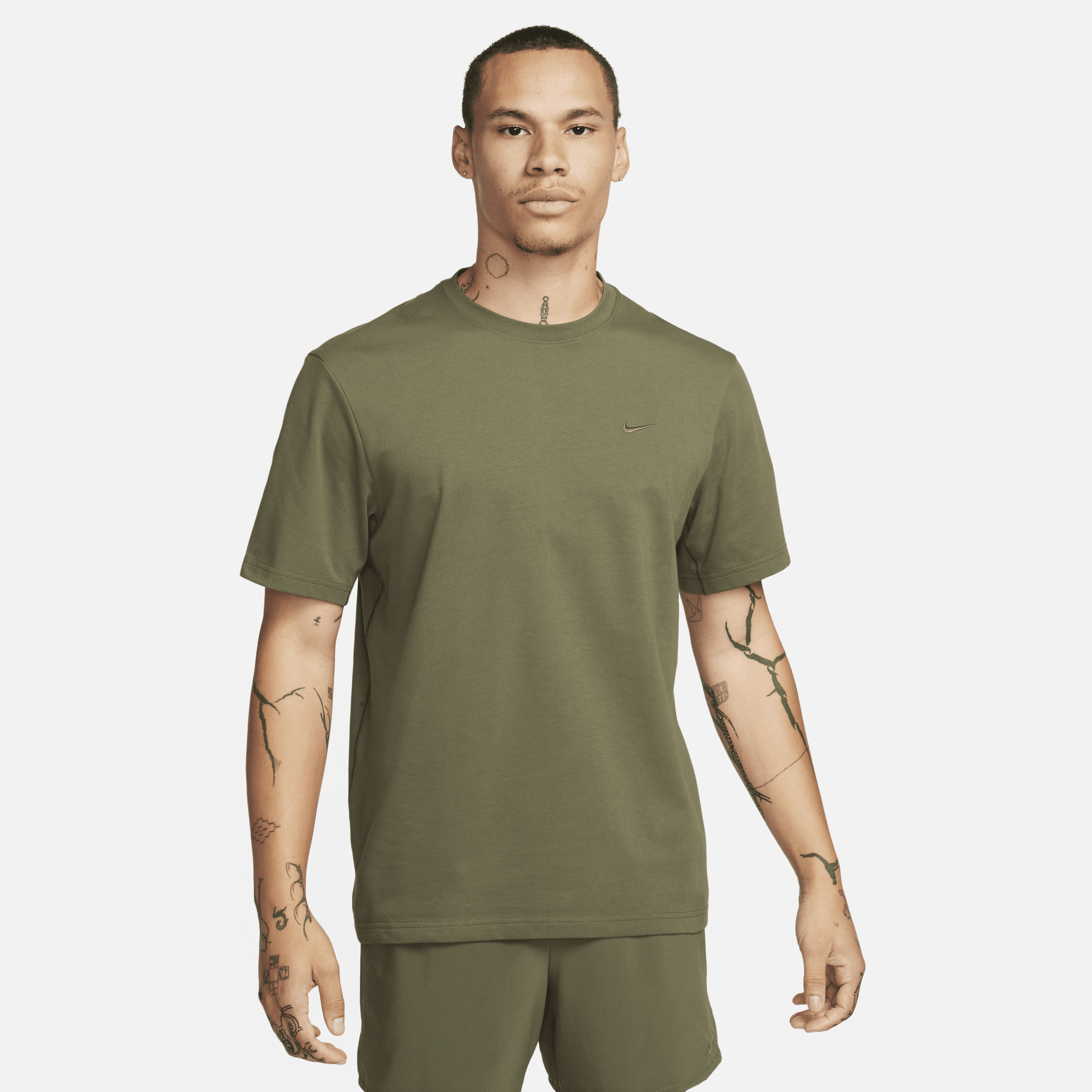 Shop Nike Men's Primary Dri-fit Short-sleeve Versatile Top In Green