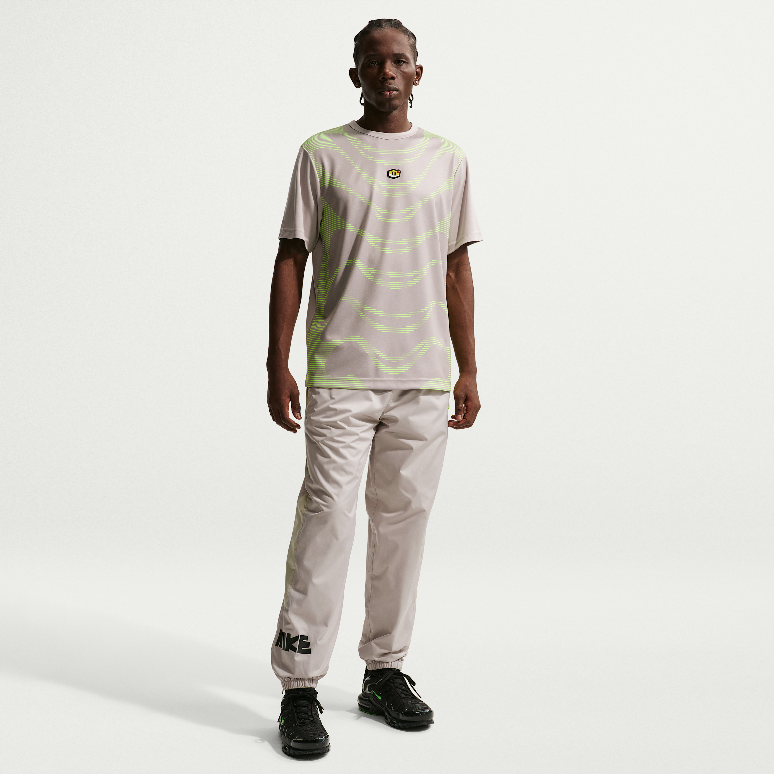Nike Men's Windrunner Graphic Woven Pants in Moon Particle/Cream II/Volt Size: Large