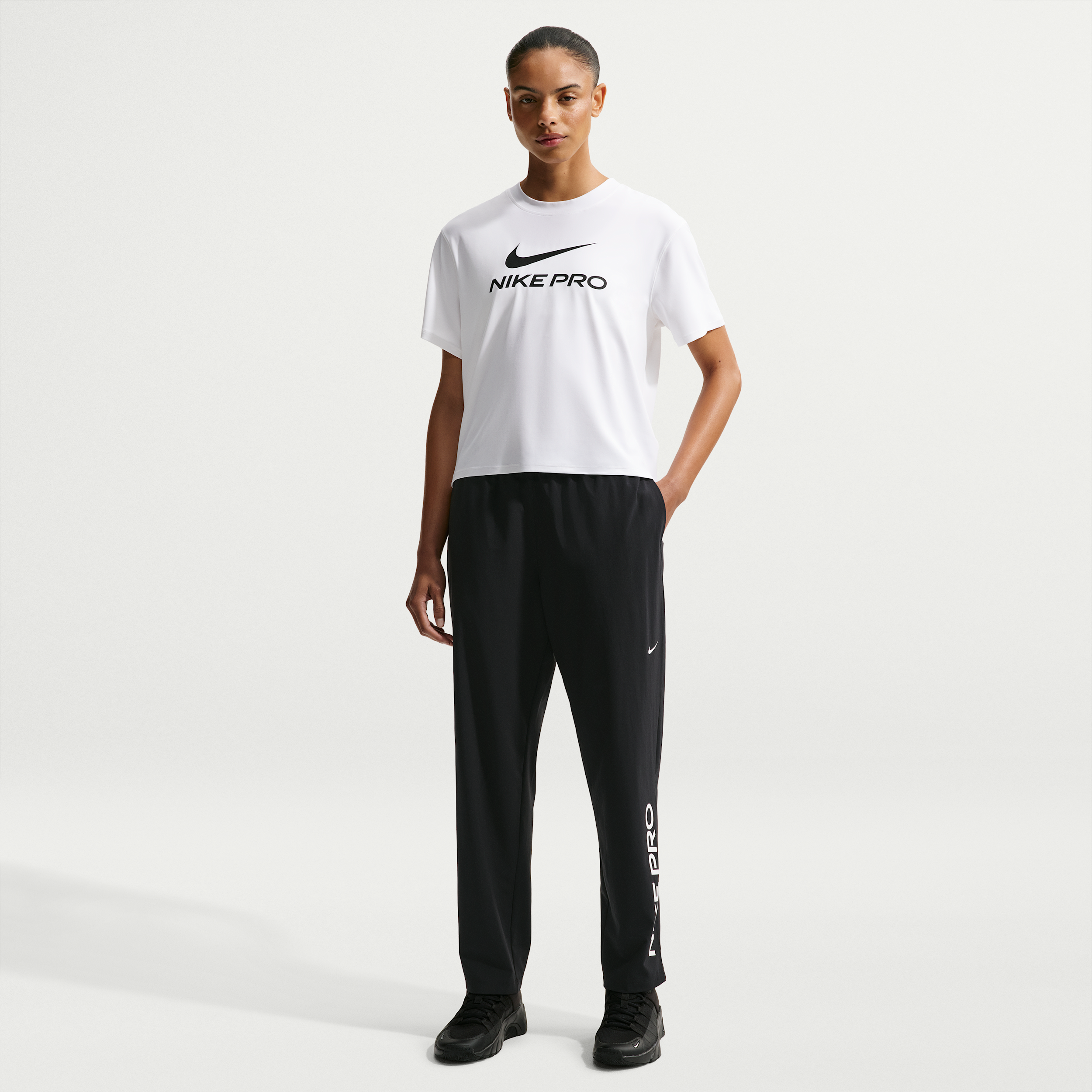 Women's Nike Pro 365 Dri-FIT Mid-Rise Woven Pants in Black | IQ0826-010