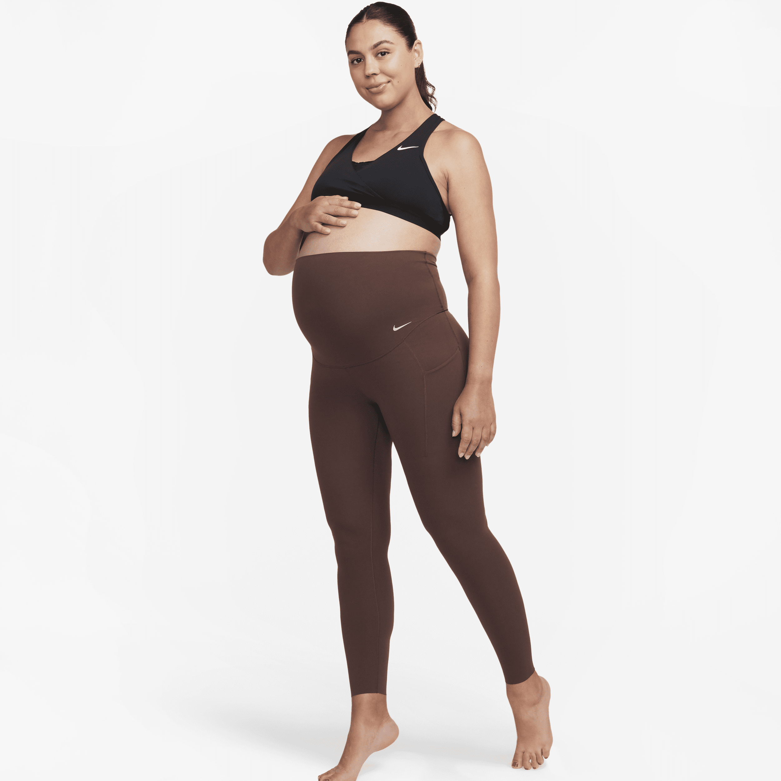 Shop Nike Women's Zenvy (m) Gentle-support High-waisted 7/8 Leggings With Pockets (maternity) In Brown
