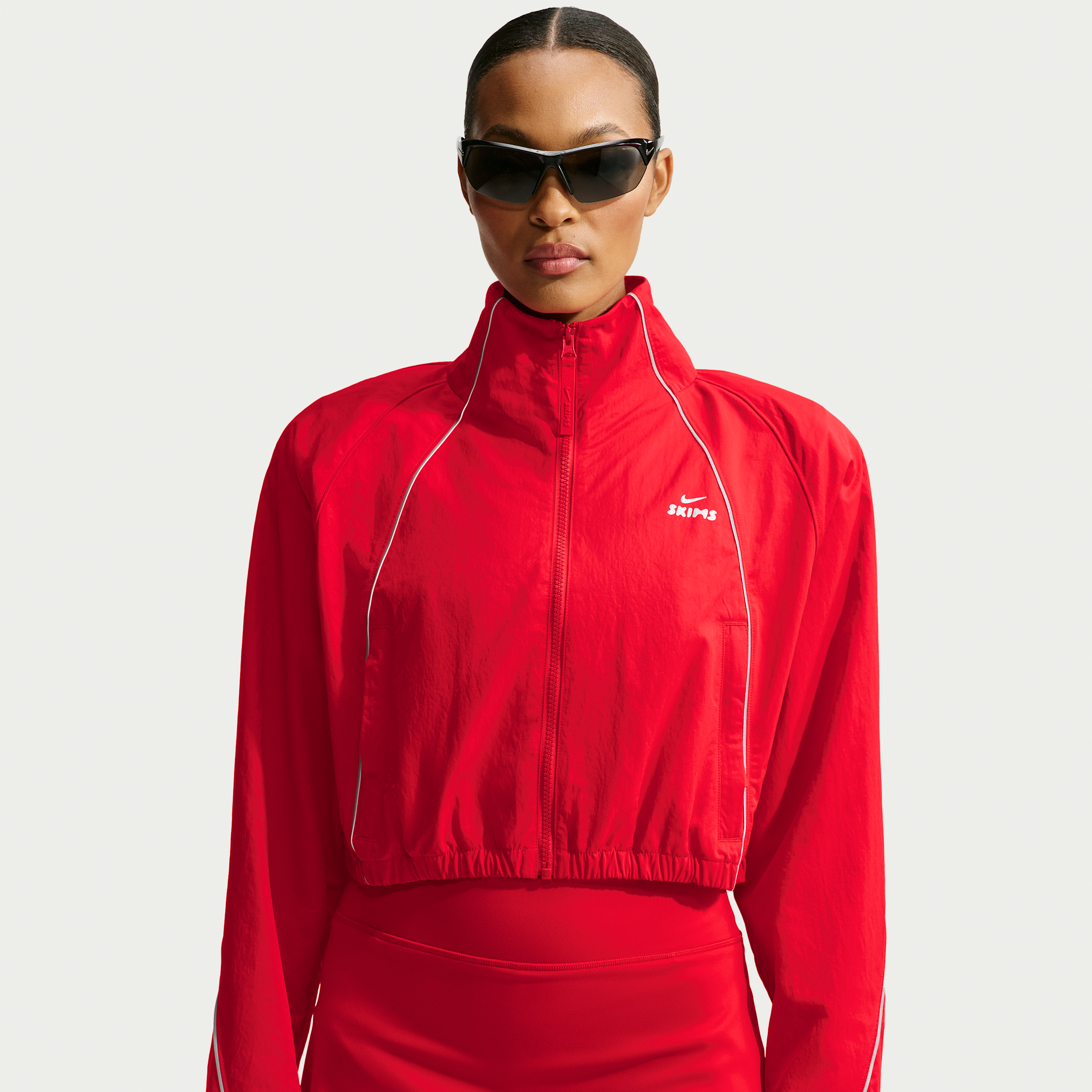 Nike Women's SKIMS Crunchy Nylon Cropped Jacket in Red | IV6641-657