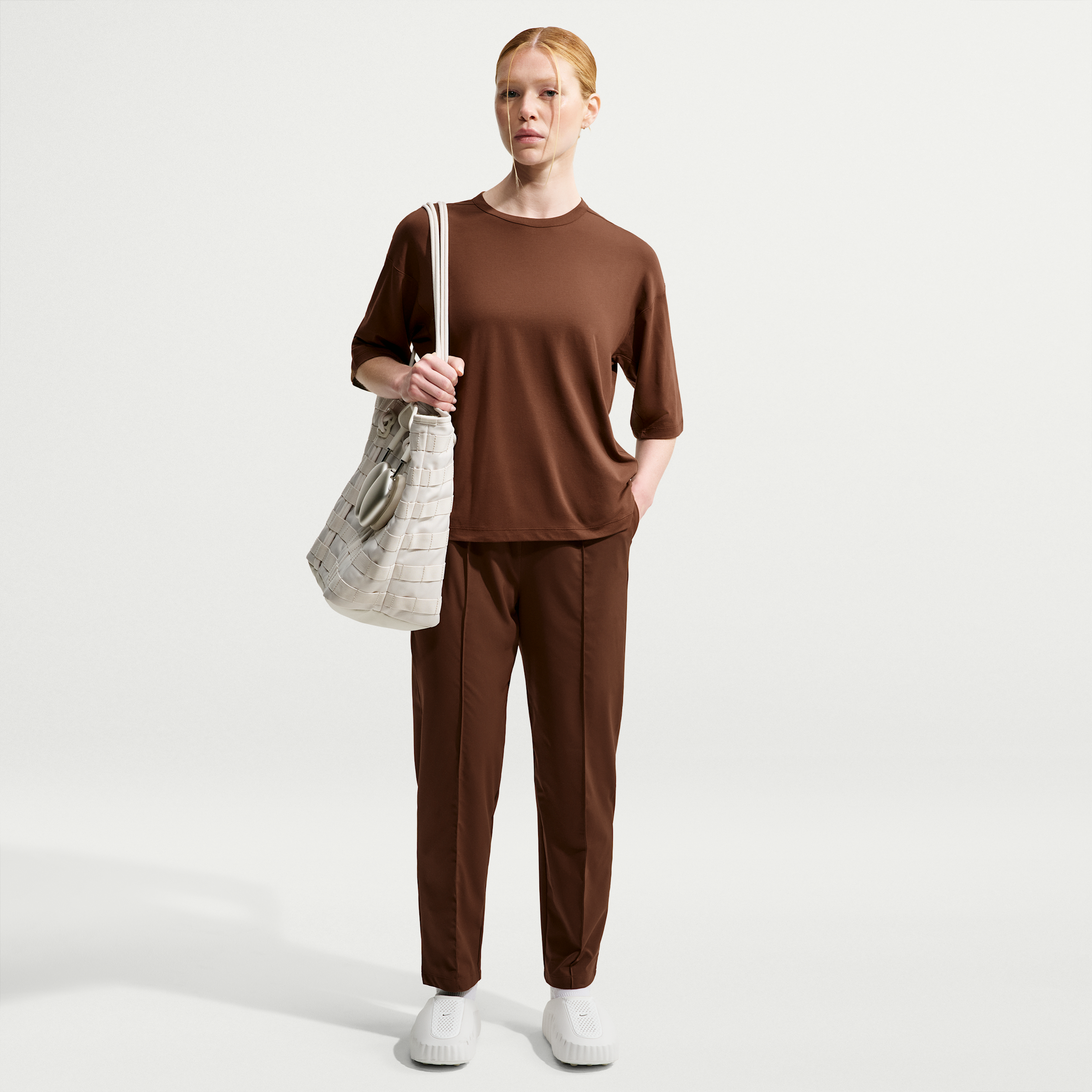 Nike Women's 24.7 PerfectStretch Dri-FIT UV Protection High-Rise Tapered Pants in Brown | HM8844-259
