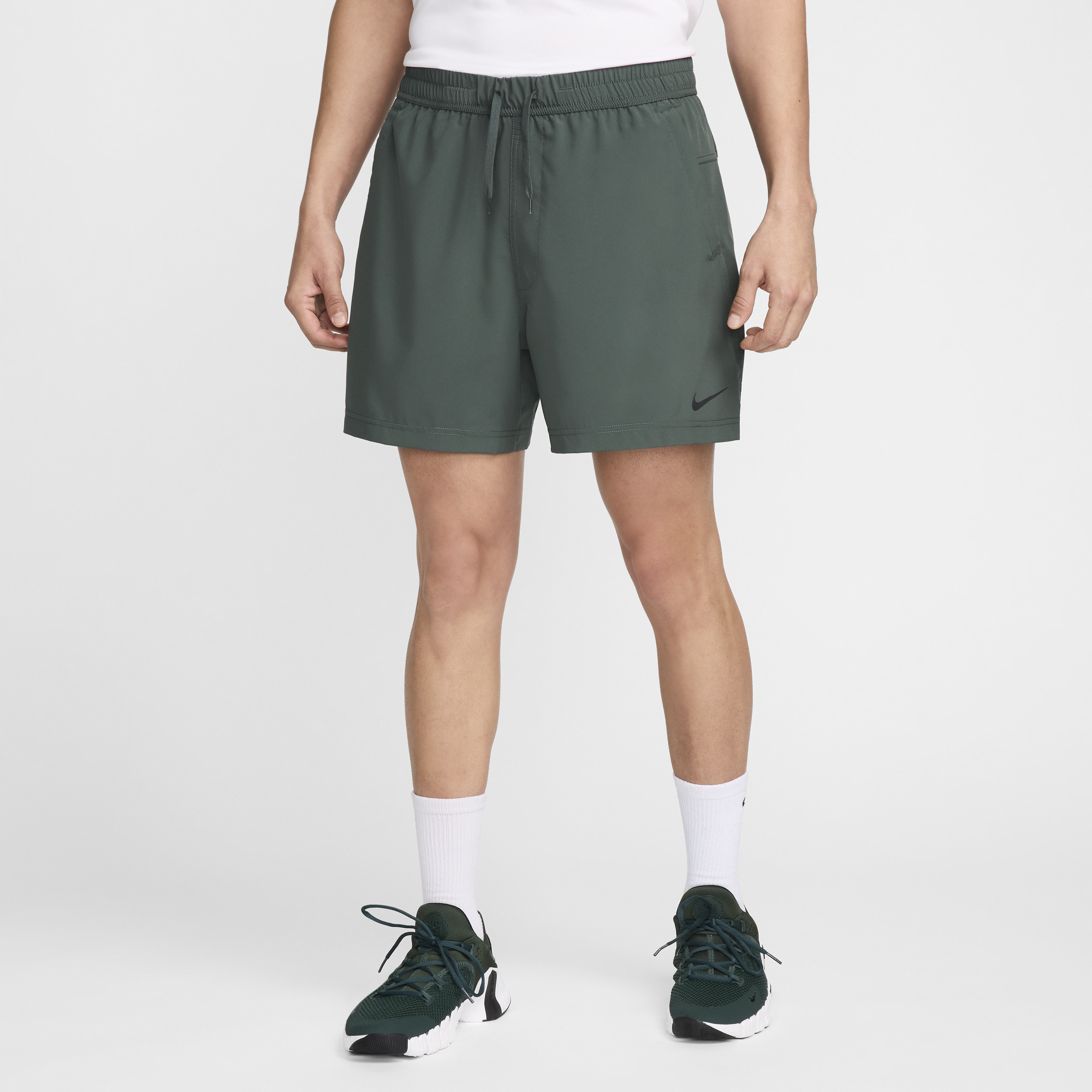 Shop Nike Men's Form Dri-fit 5" Unlined Versatile Shorts In Green