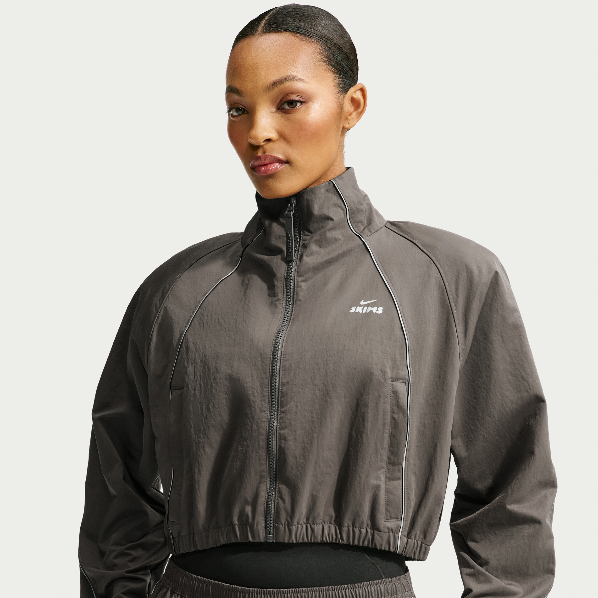 Nike Women's SKIMS Crunchy Nylon Cropped Jacket in Grey | IV6641-080