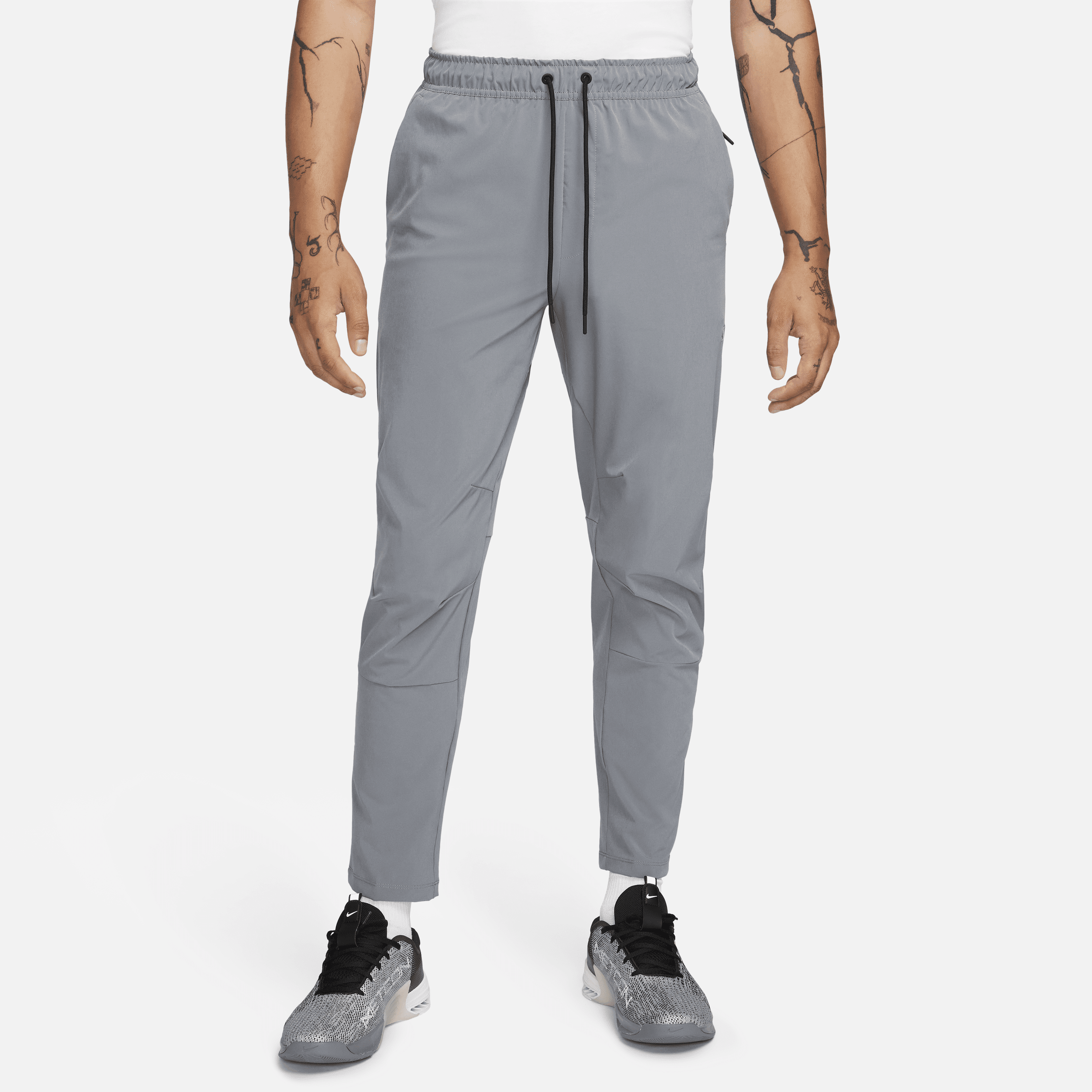 Shop Nike Men's Unlimited Dri-fit Tapered Leg Versatile Pants In Grey