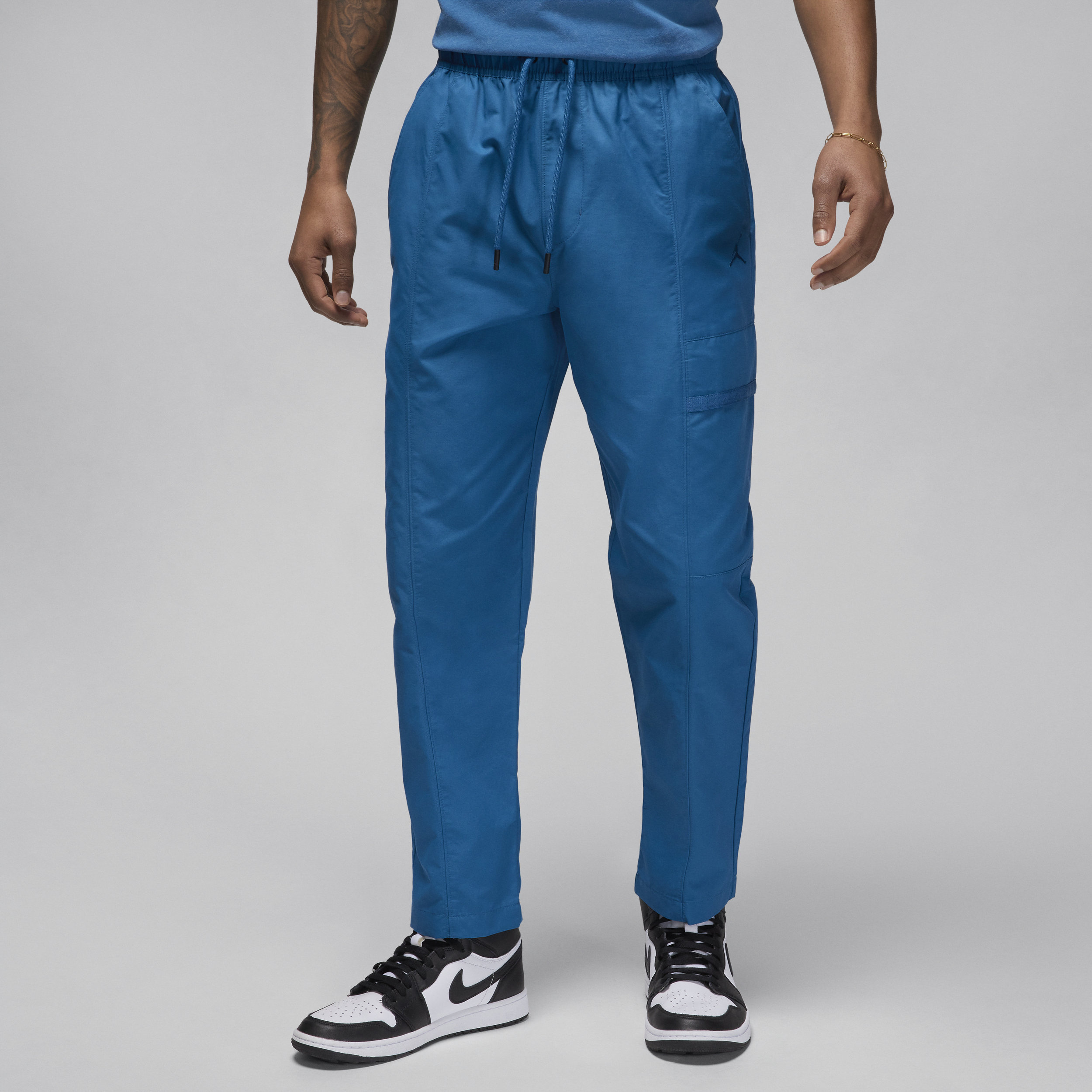 Shop Jordan Men's  Essentials Woven Pants In Blue