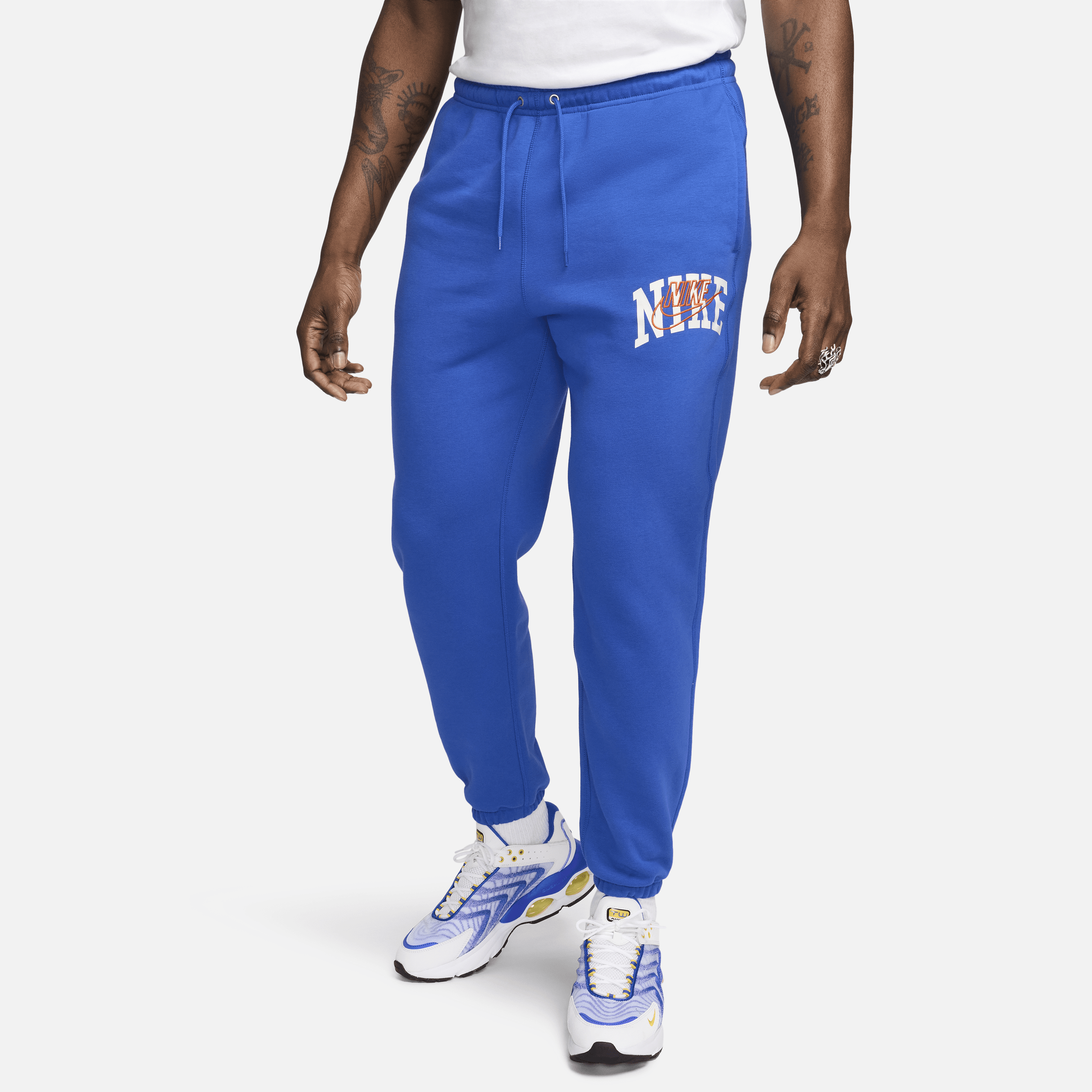 Shop Nike Men's Club Fleece Cuffed Pants In Blue