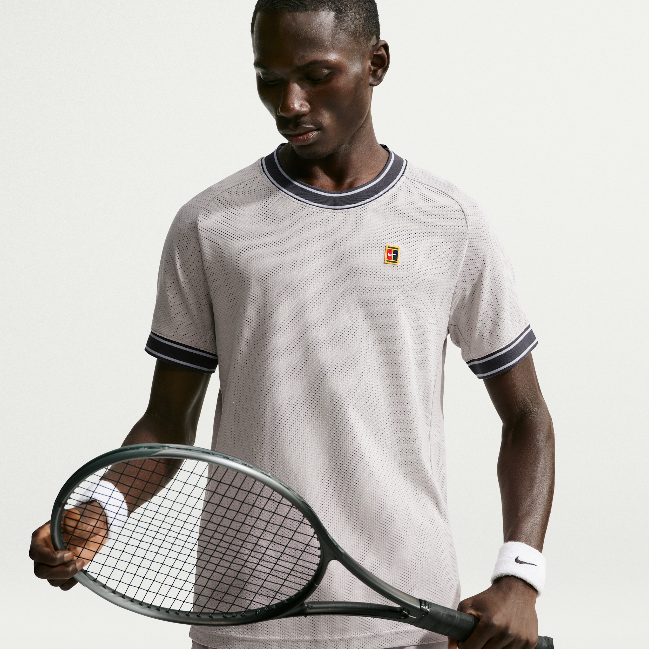 Nike Men's Court Heritage Short-Sleeve Tennis Top in Purple | FN0318-022