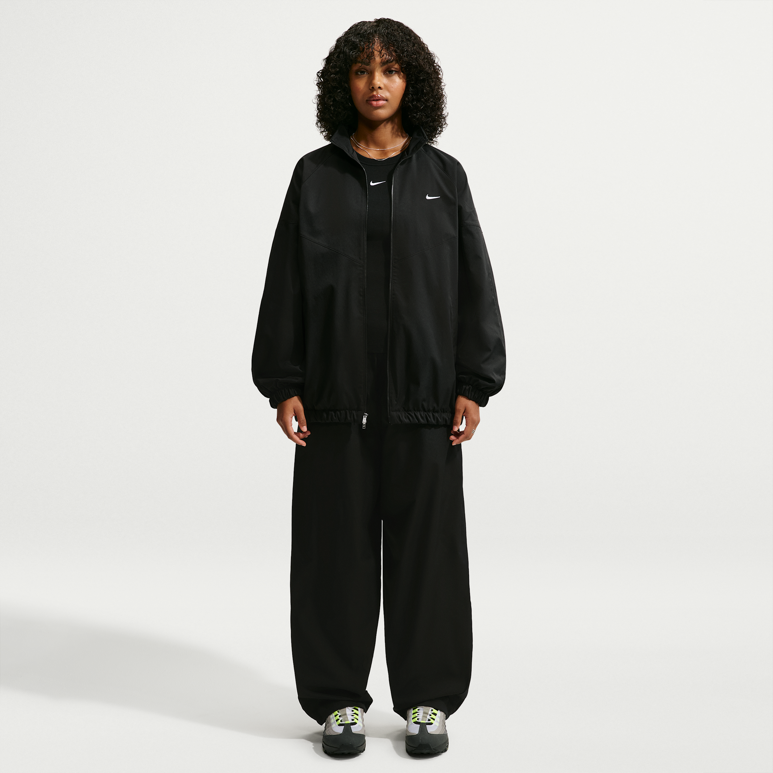 Women's Nike Sportswear Loose High-Waisted Track Pants in Black | IQ3166-010