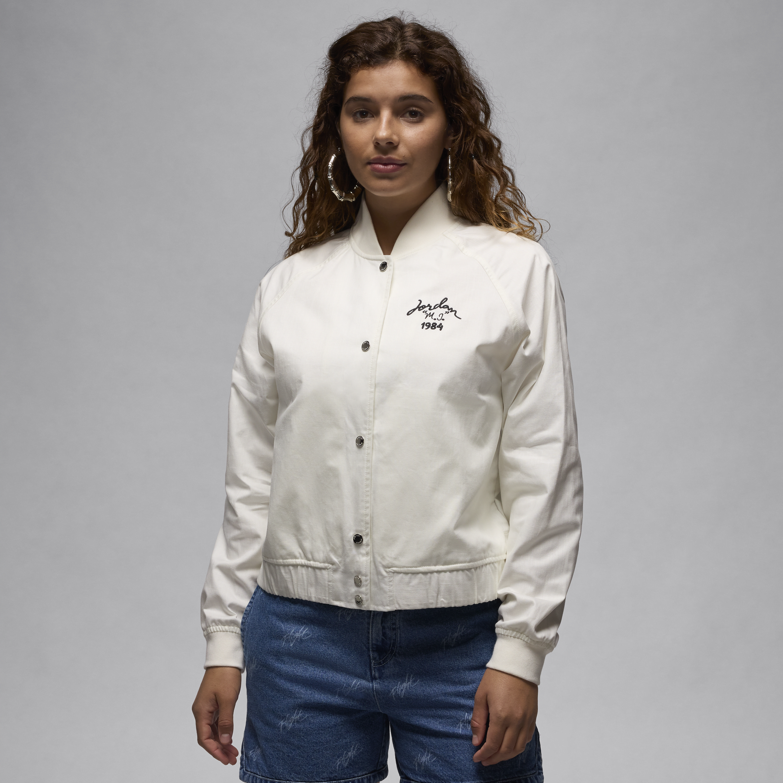 Shop Jordan Women's  Varsity Jacket In White