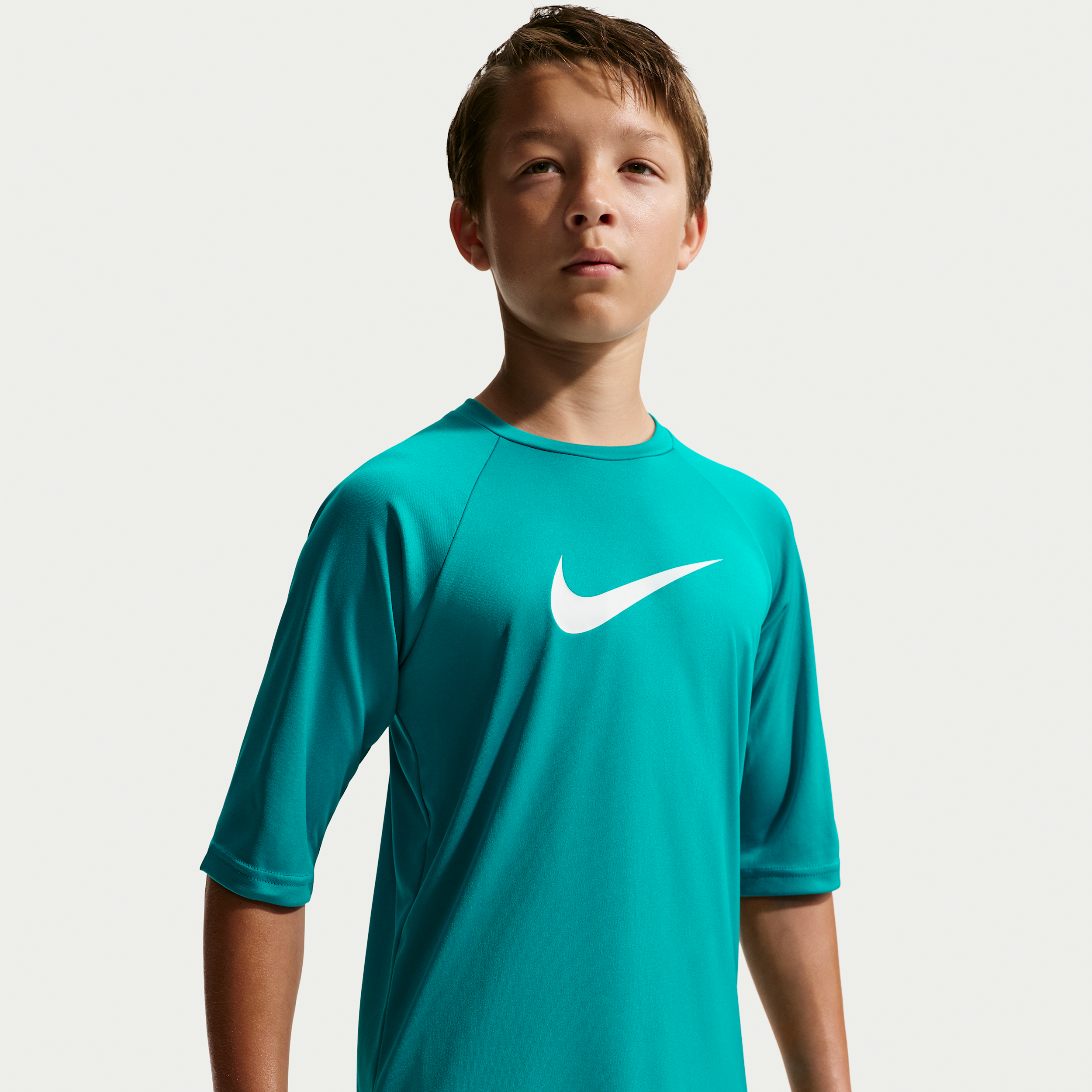 Nike Swim Hydroguard Essential Big Kids' (Boys') Dri-FIT UV Short Sleeve Top in Green | NESSD828-385