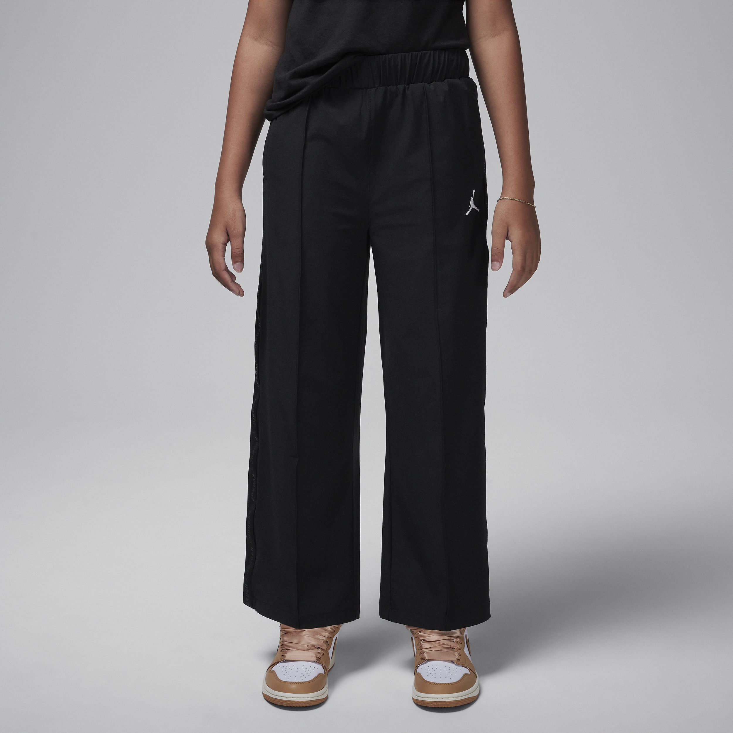 Shop Jordan Big Kids' Jumpman Woven Taping Pants In Black