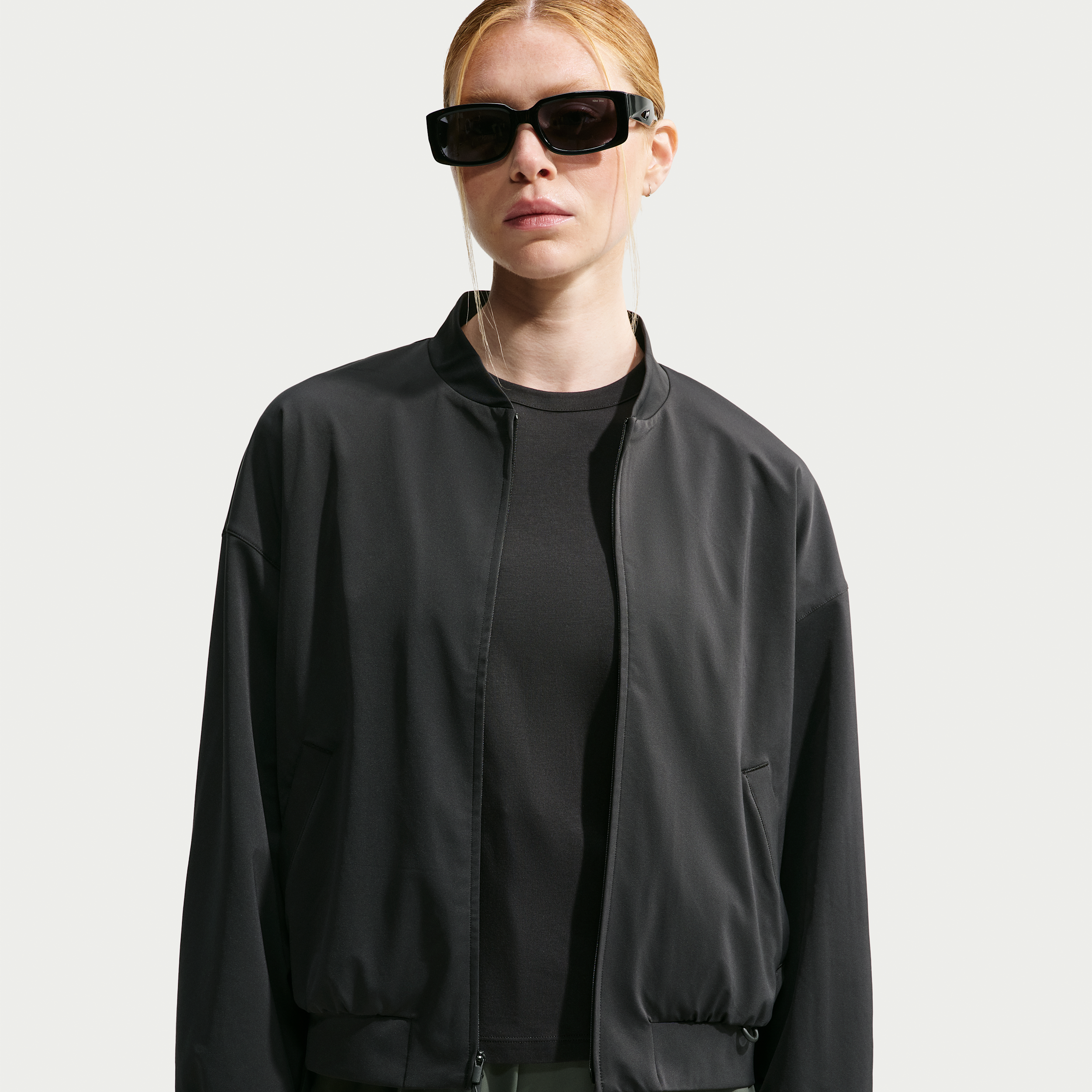 Nike Women's 24.7 PerfectStretch Dri-FIT UV Protection Oversized Bomber Jacket in Black | IO2405-010