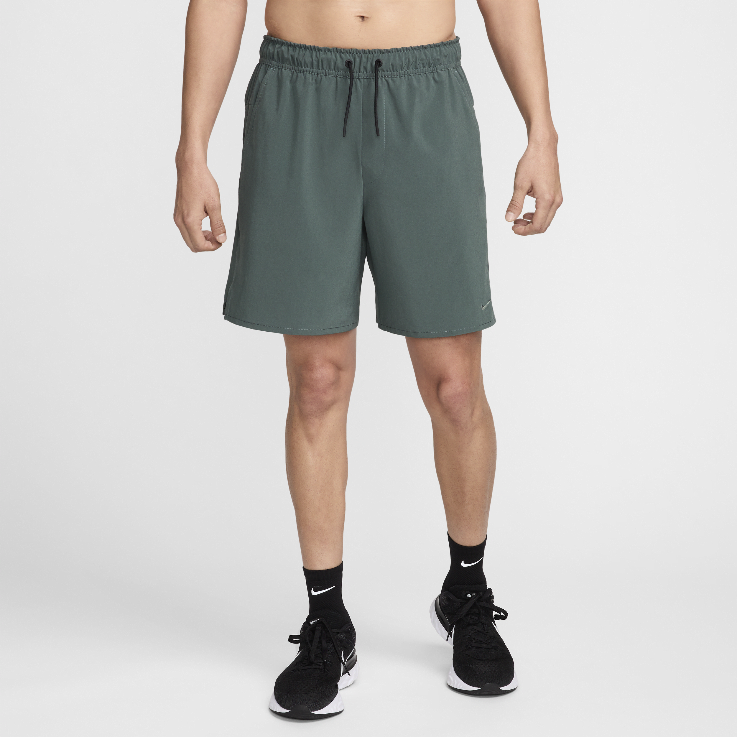 Shop Nike Men's Unlimited Dri-fit 7" Unlined Versatile Shorts In Green