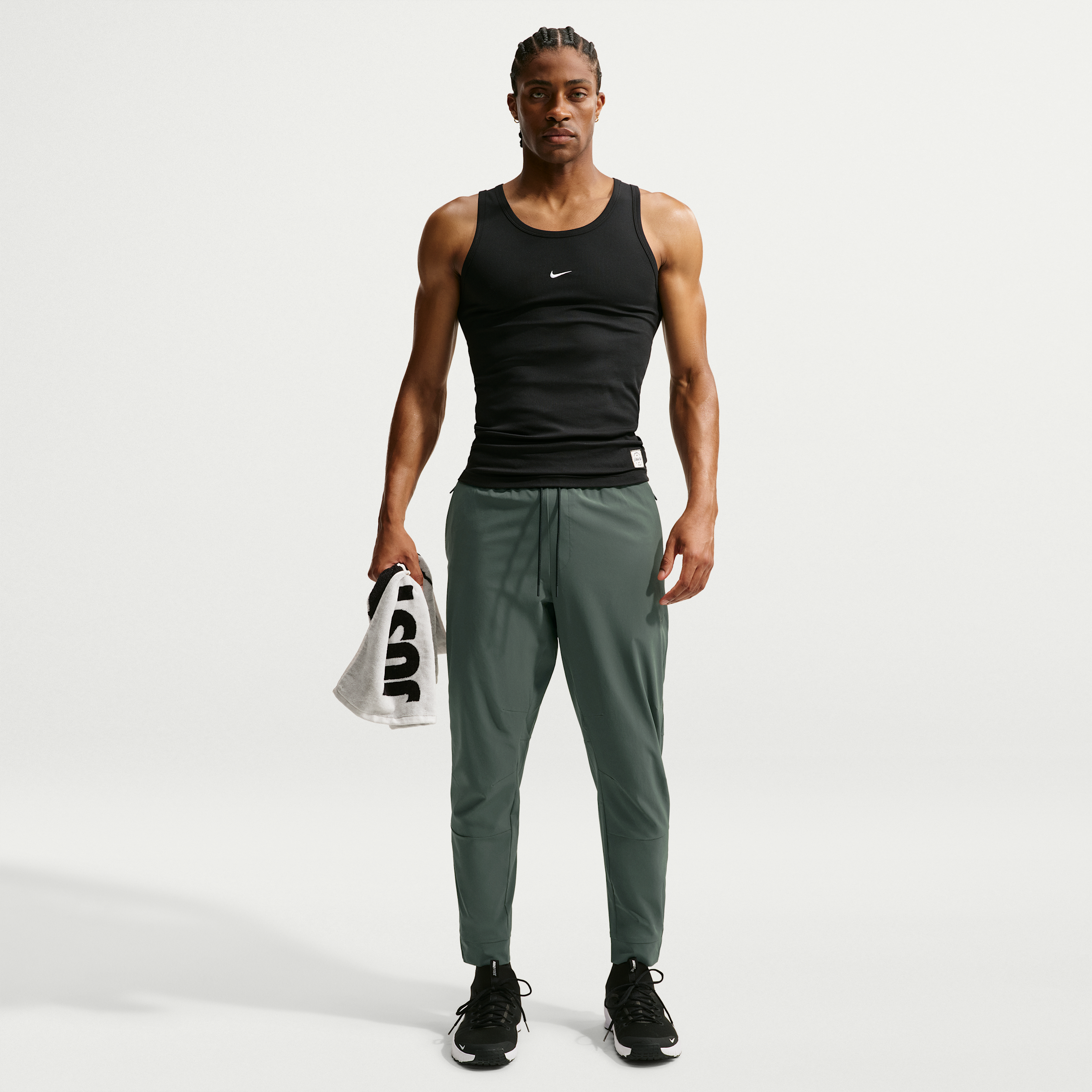 Nike Men's Unlimited Dri-FIT Zippered Cuff Versatile Pants in Green | FB7548-303