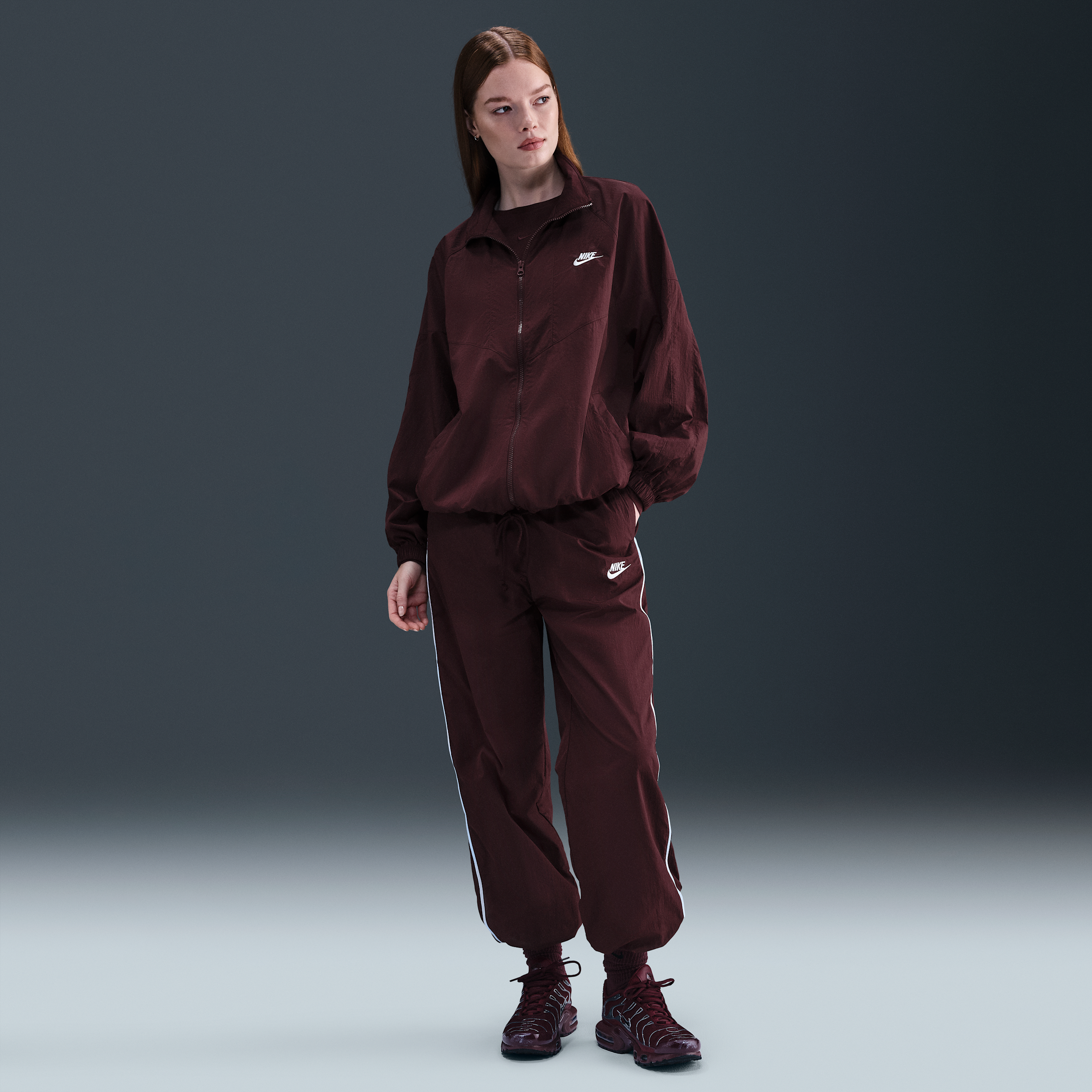 Nike Women's  Sportswear Windrunner Woven Pants In Burgundy