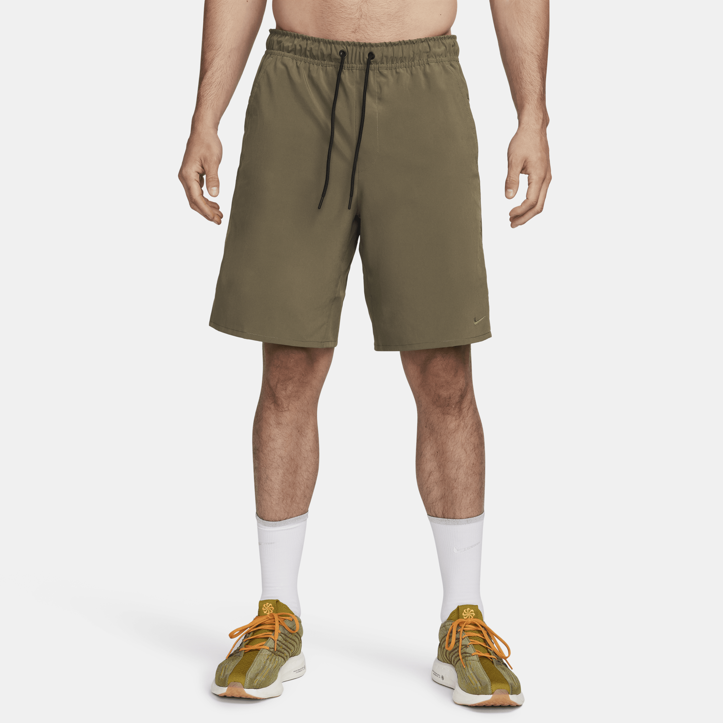 Shop Nike Men's Unlimited Dri-fit 9" Unlined Versatile Shorts In Green