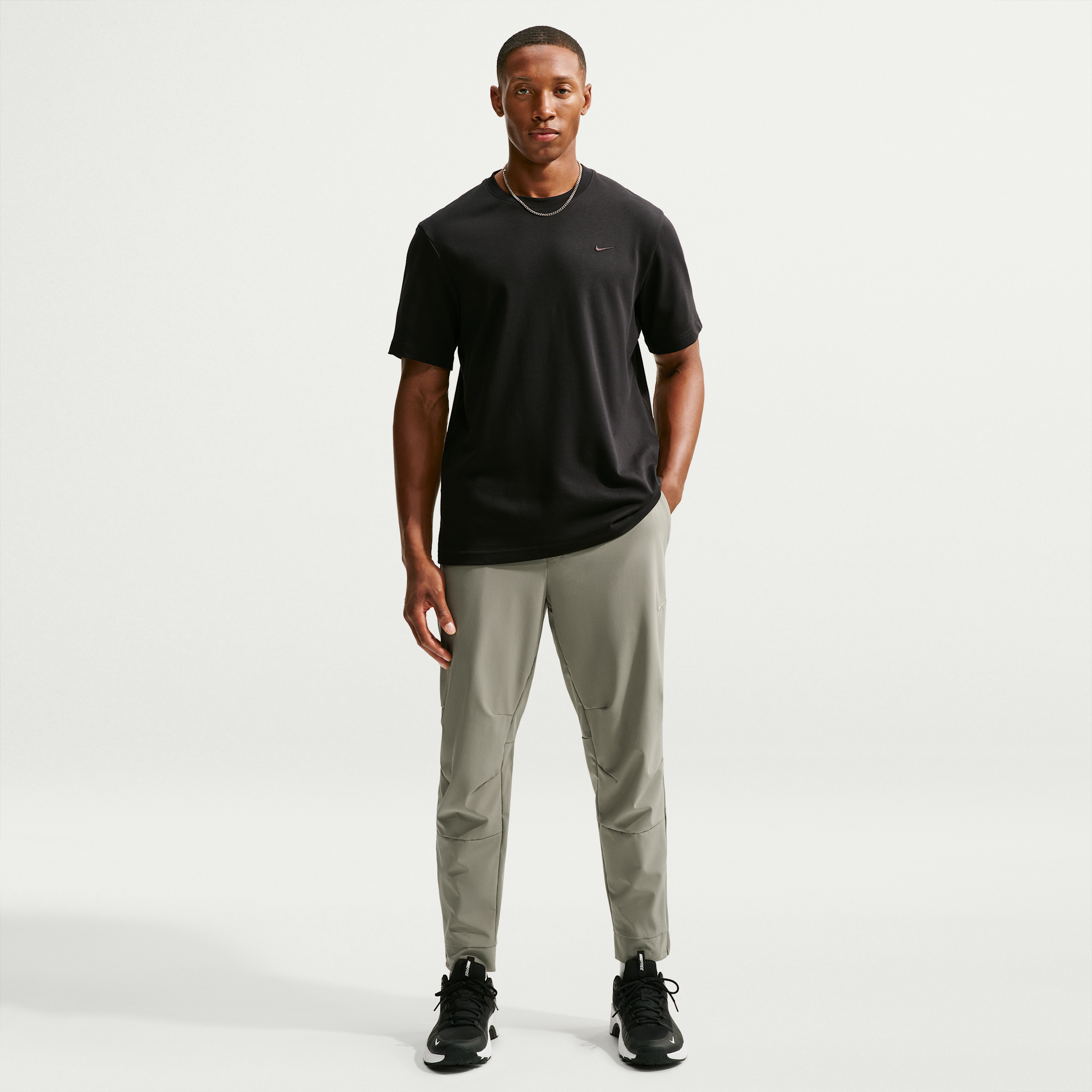 Nike Men's Unlimited Dri-FIT Zippered Cuff Versatile Pants in Green | FB7548-320