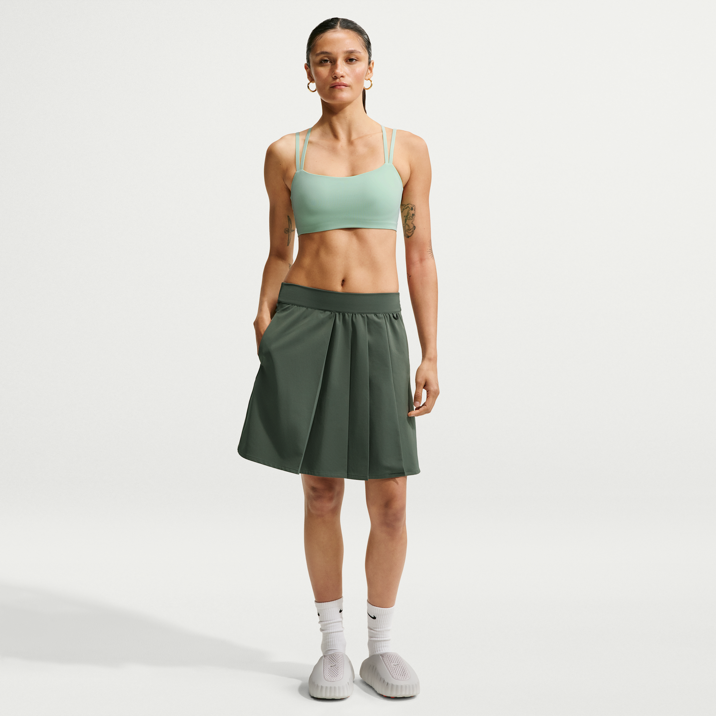 Nike Women's 24.7 PerfectStretch Dri-FIT UV Protection High-Rise Pleated Skirt in Green | IR8705-303