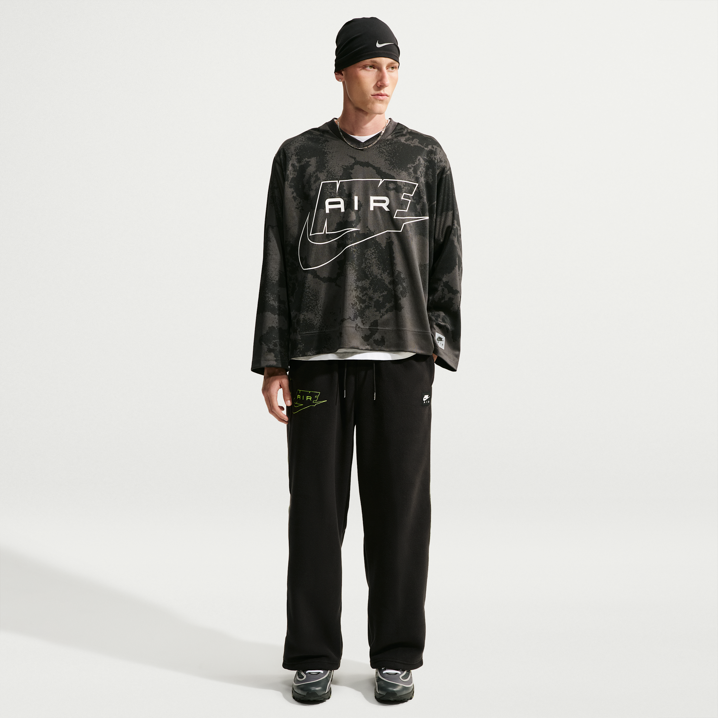 Nike Men's Air Polartec® Therma-FIT Open-Hem Pants in Black | IQ6511-010