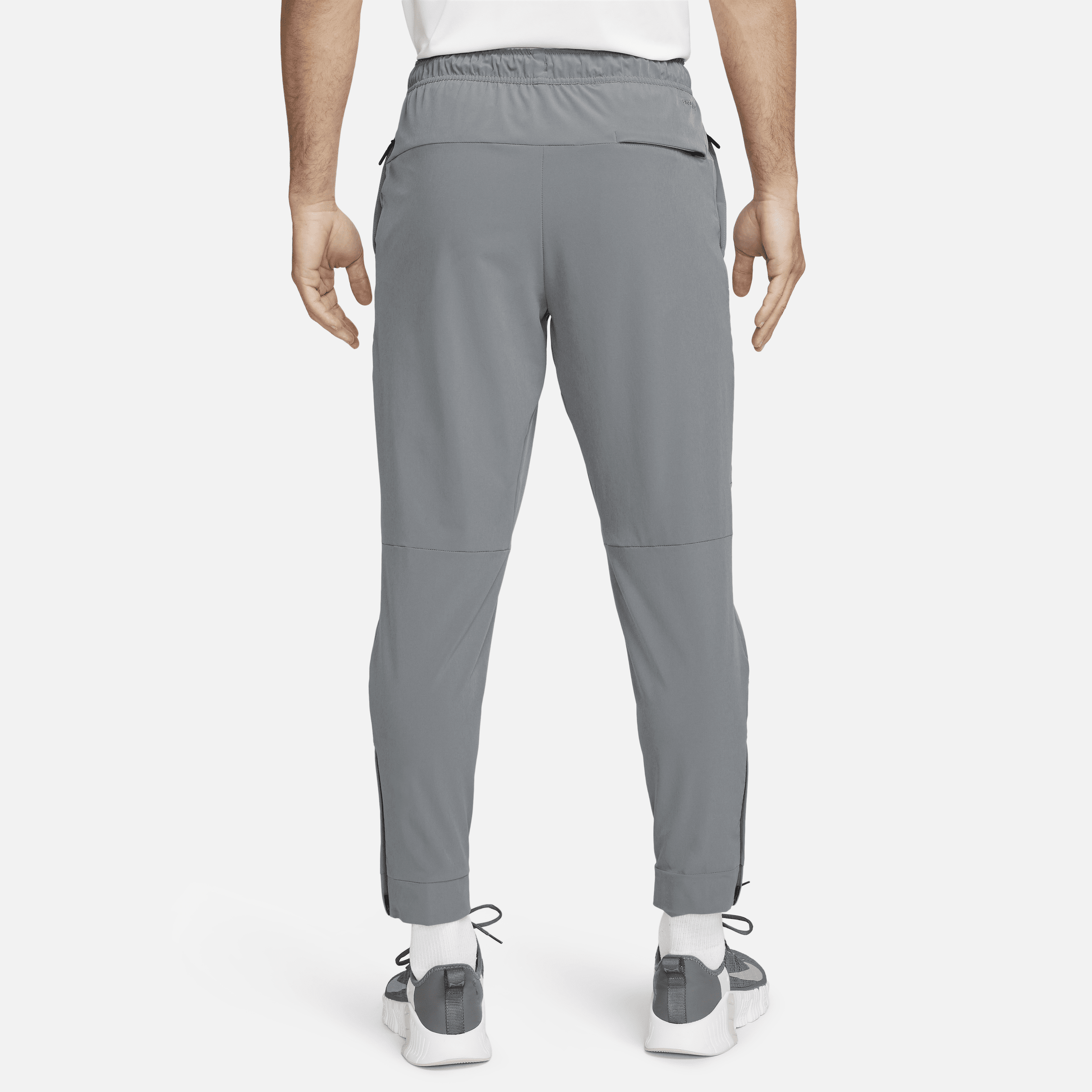 Pantalon avec ouvertures à zip Nike Dri-FIT Unlimited pour homme - Gris