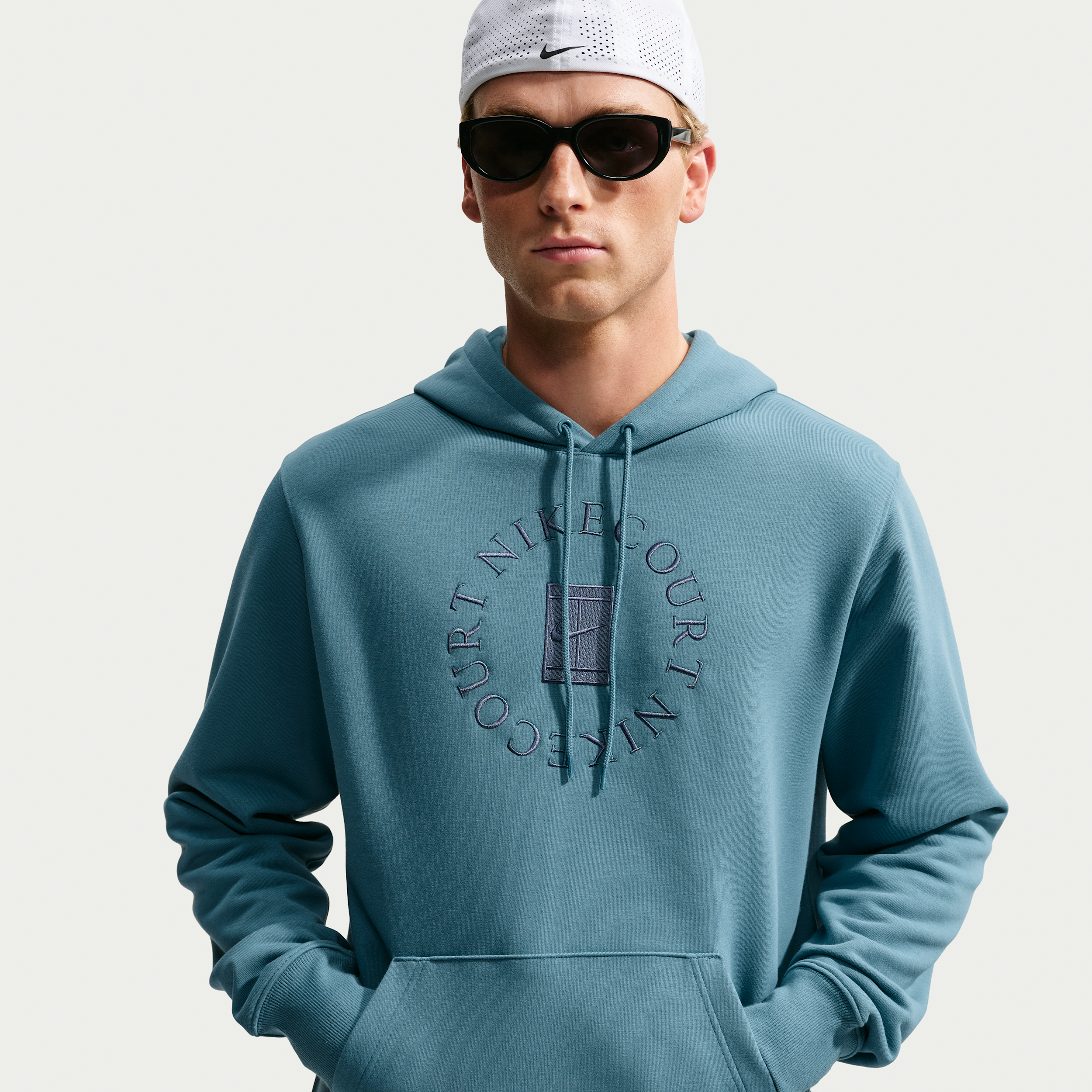 NikeCourt Heritage Dri-FIT-tennishættetrøje i french terry til mænd - blå