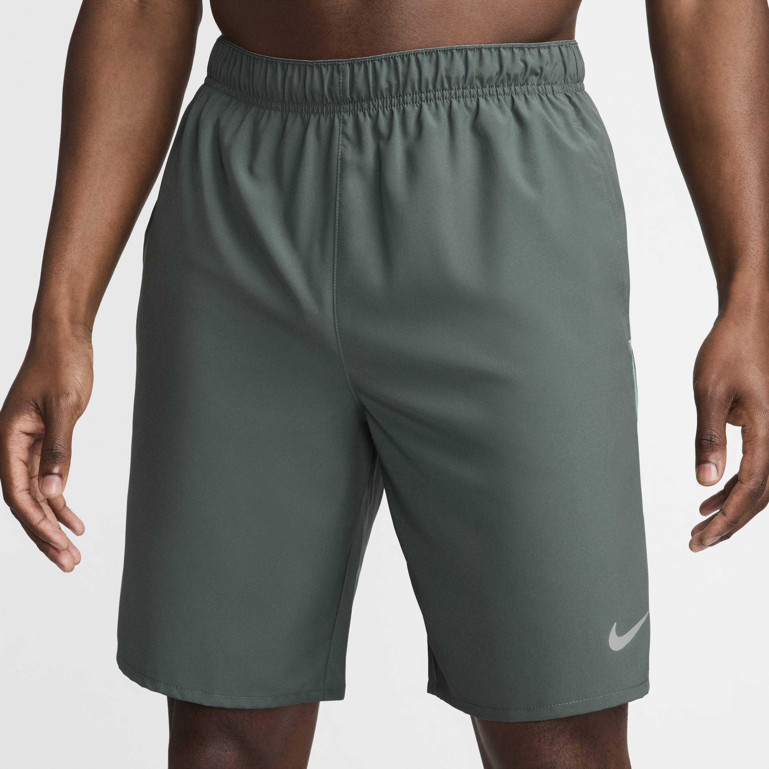 Nike Challenger multifunctionele niet-gevoerde herenshorts met Dri-FIT (23 cm) Groen