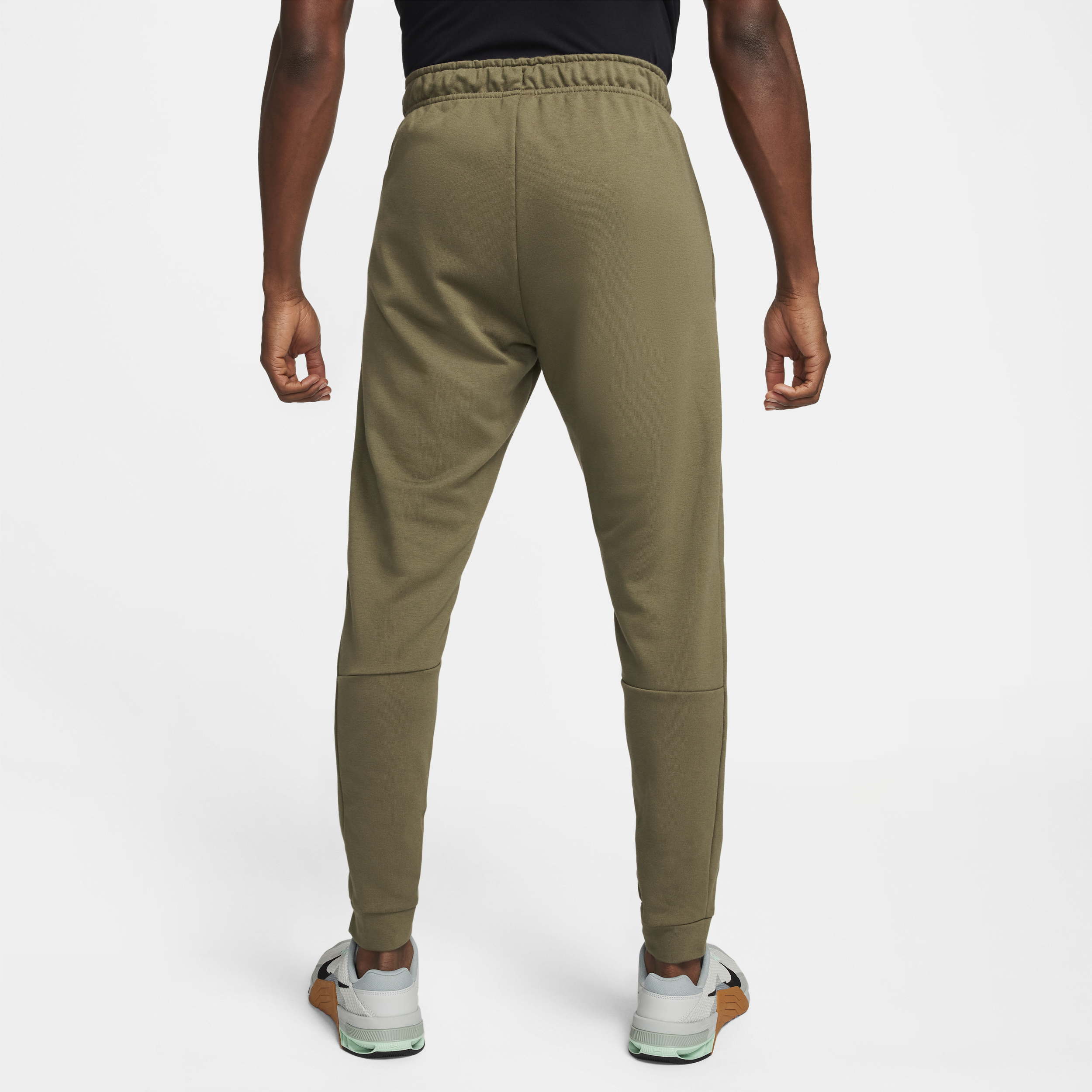 Nike Dry Dri-FIT toelopende fitnessbroek van fleece voor heren Groen