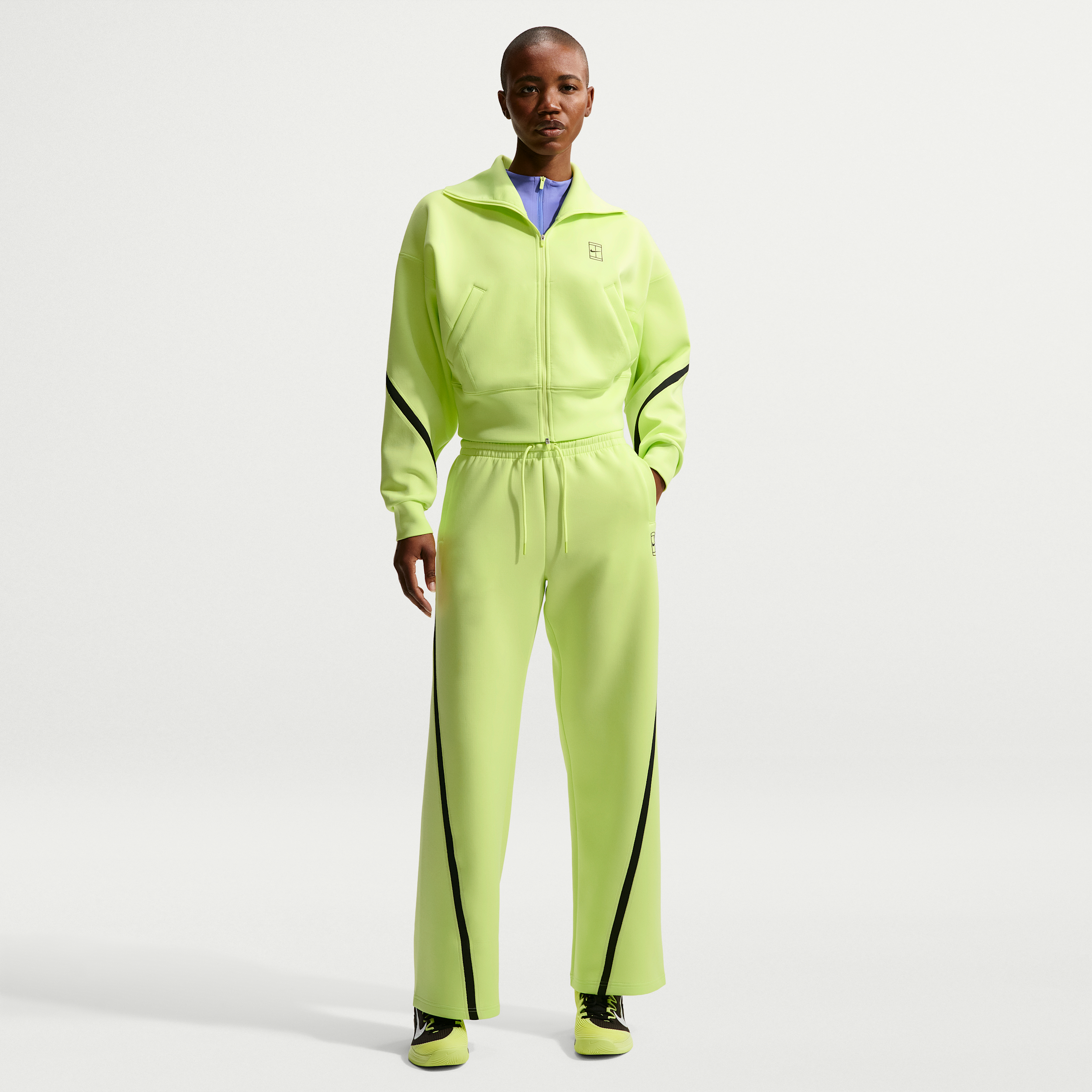 Pantaloni da tennis a vita media Dri-FIT Nike Advantage – Donna - Giallo