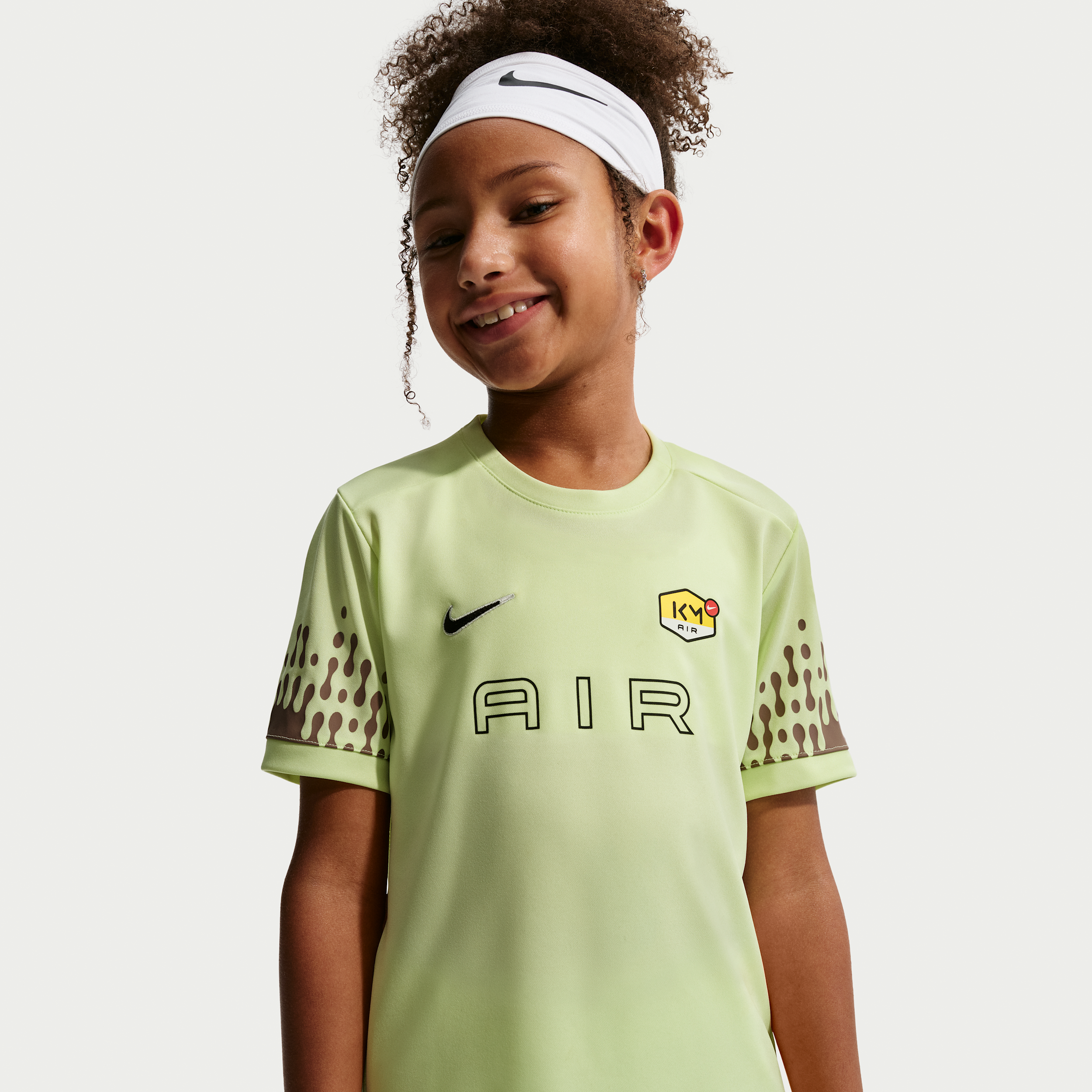 Thumbnail - Kylian Mbappé Academy Dri-FIT-Fußballoberteil (ältere Kinder) - Grün