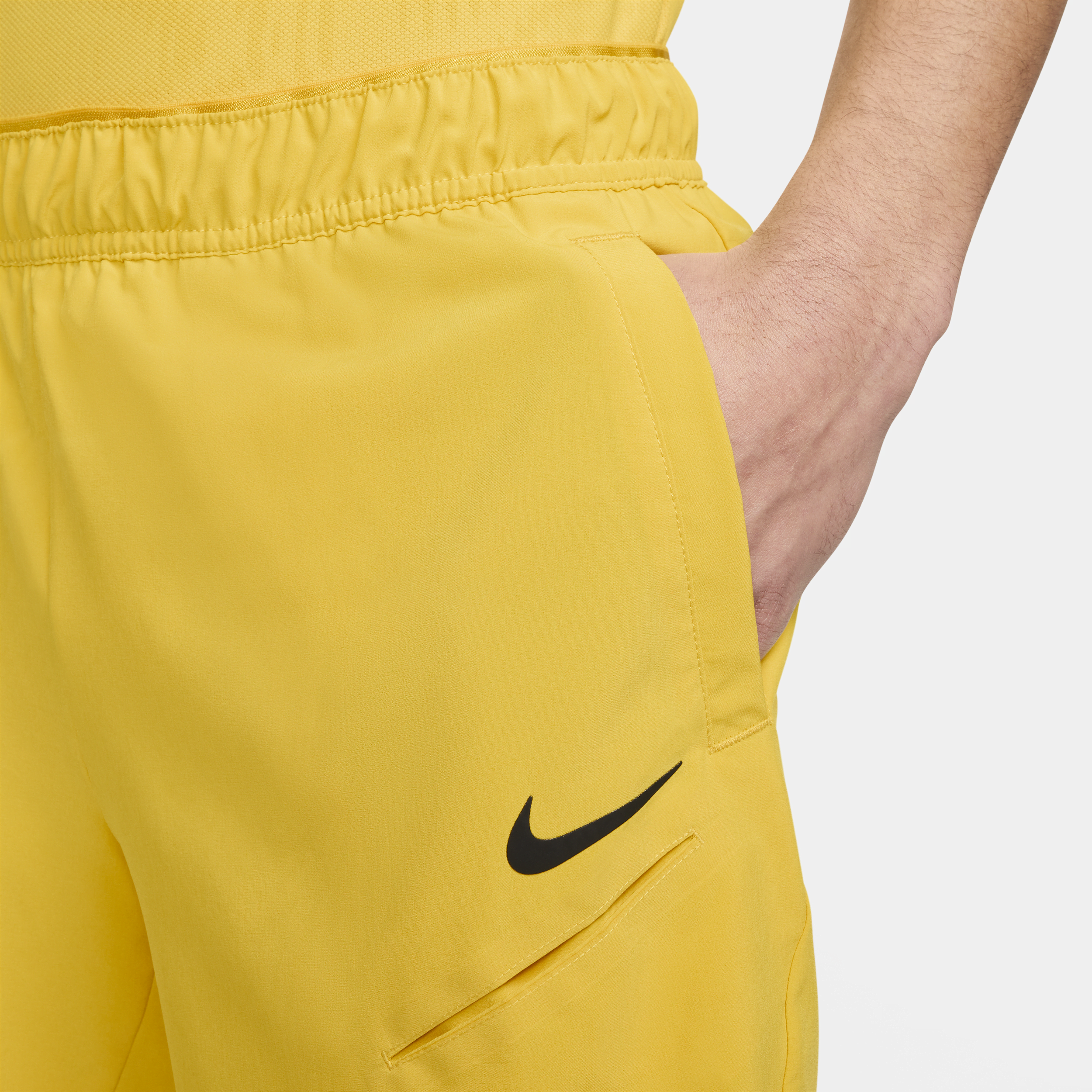 Nike Court Slam Dri-FIT tennisshorts voor heren Geel