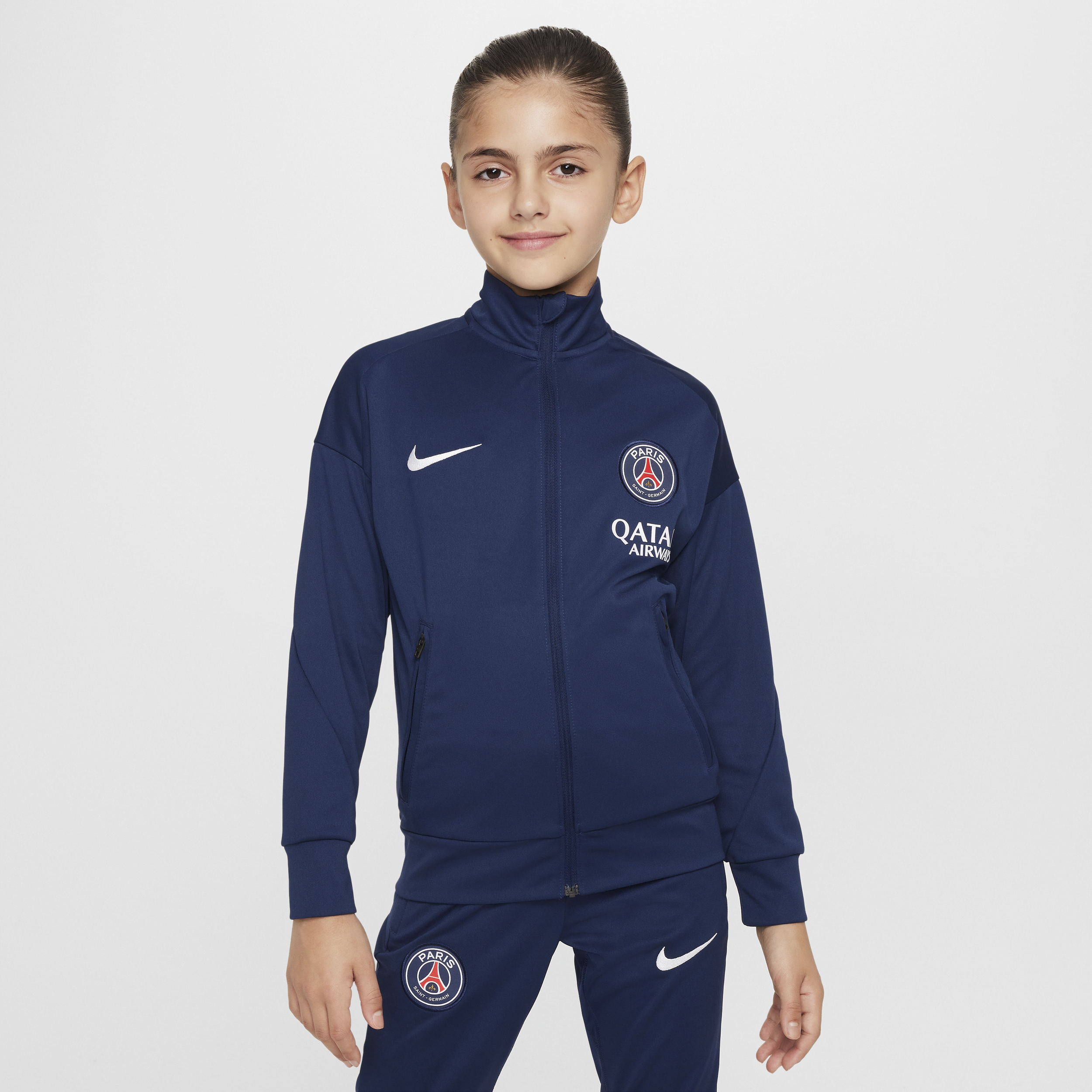 Thumbnail - Paris Saint-Germain Academy Pro Nike Dri-FIT Fußball-Trainingsanzug aus Strickmaterial für ältere Kinder - Blau