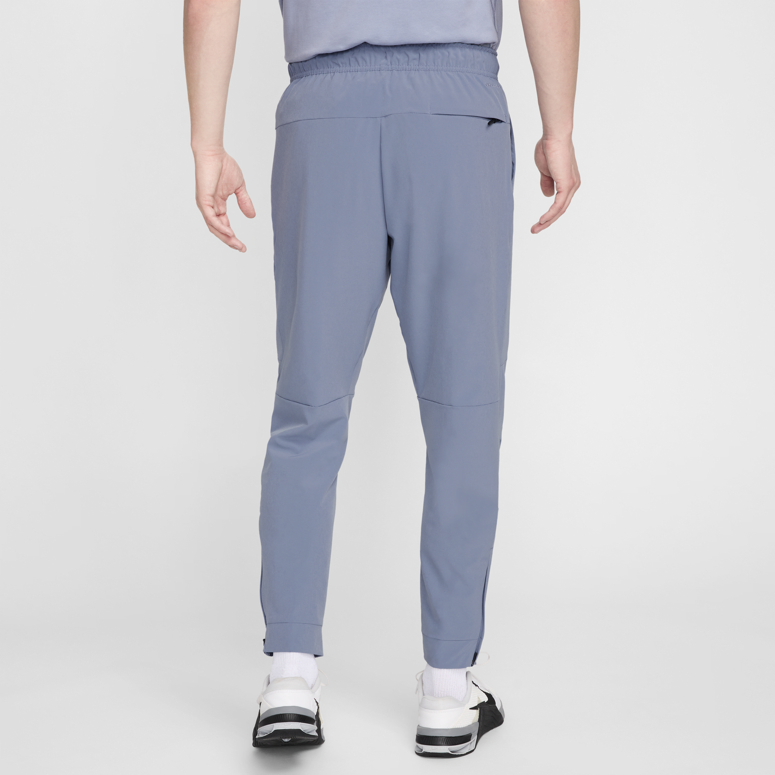 Pantalon avec ouvertures à zip Nike Dri-FIT Unlimited pour homme - Bleu