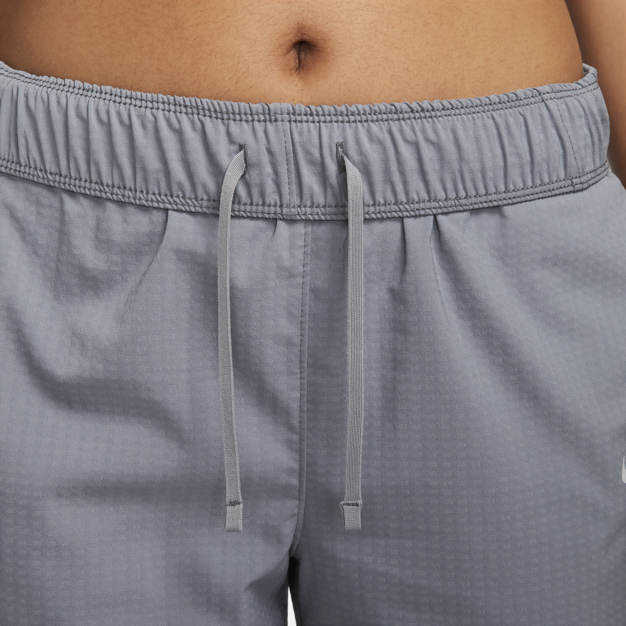 Nike Dri-FIT Fast 7 8-hardloopbroek met halfhoge taille voor warming-up voor dames Grijs