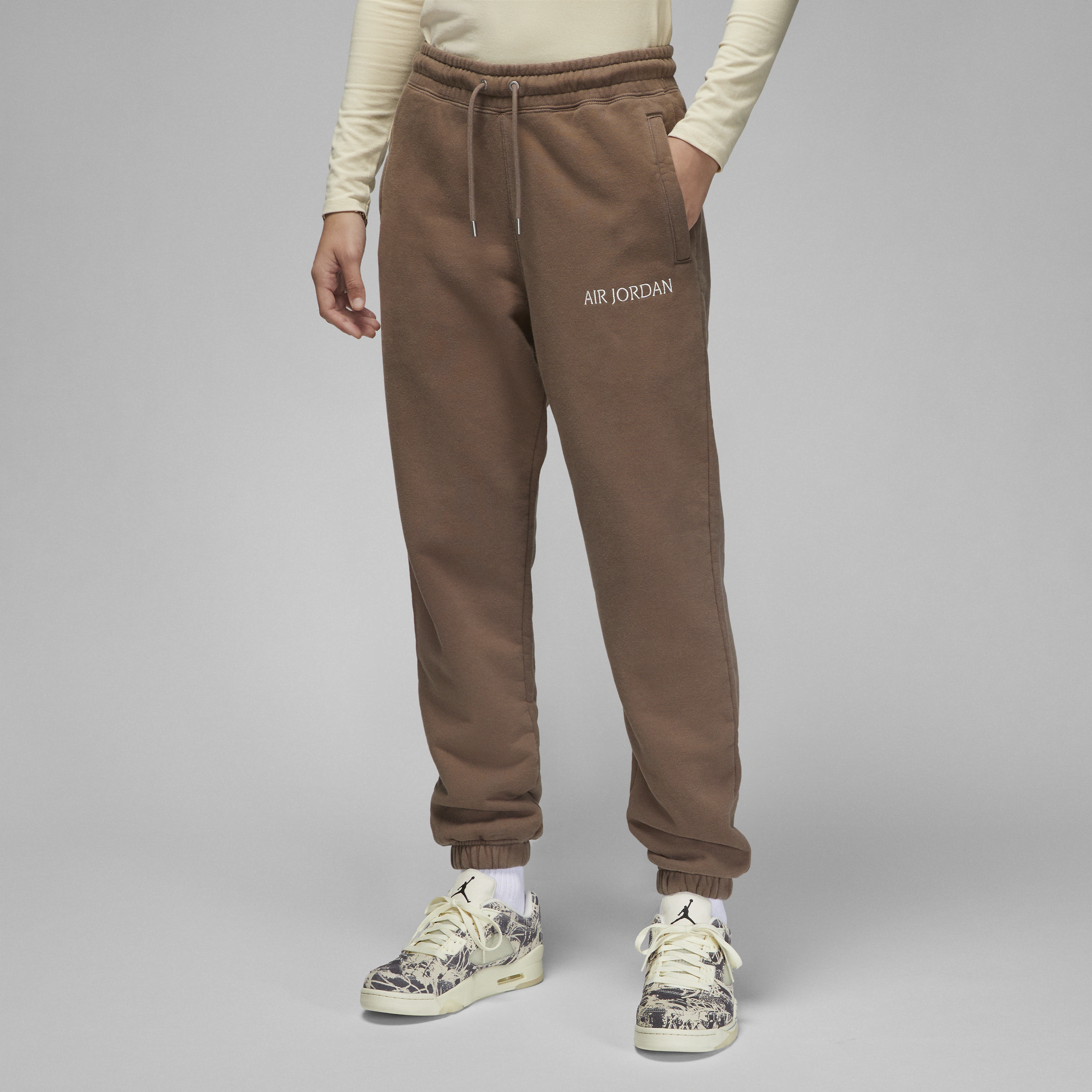 Damskie spodnie z dzianiny Air Jordan Wordmark - Brązowy