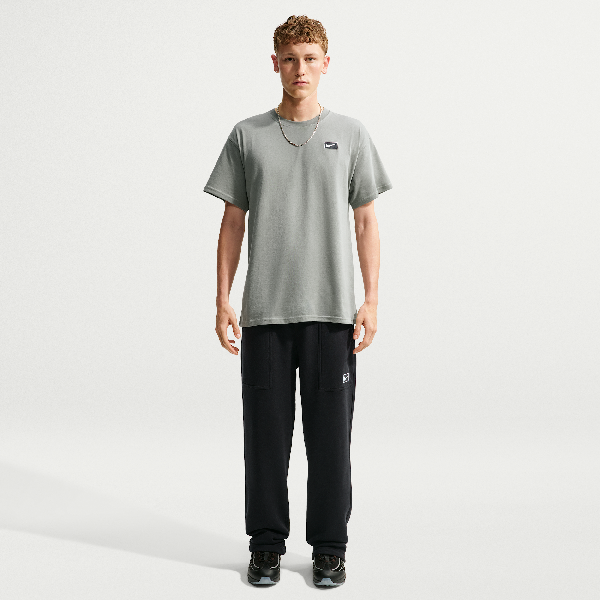 Nike -fleecebukser med åben kant forneden til mænd - sort