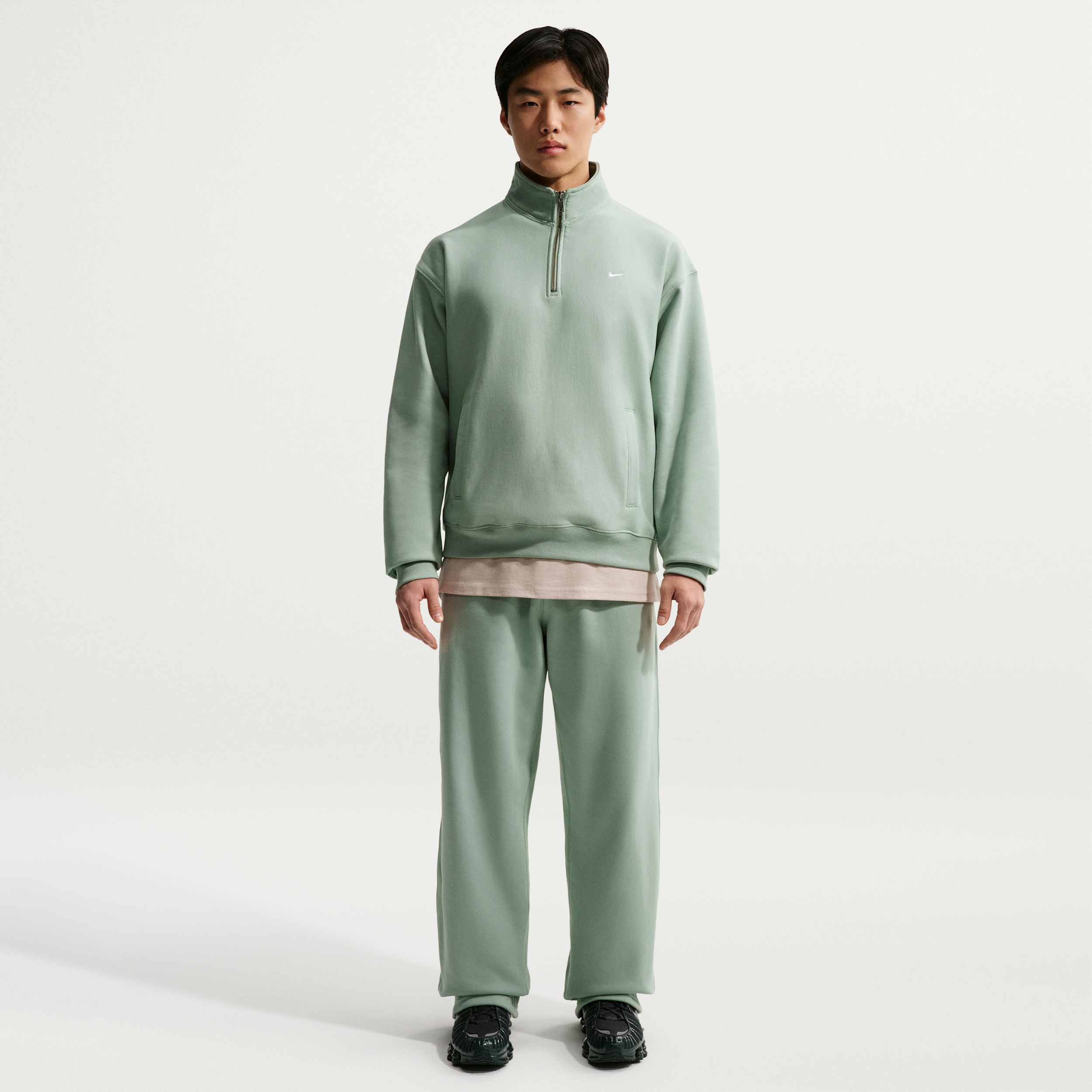 Nike Solo Swoosh-fleecebukser med åben kant til mænd - grøn