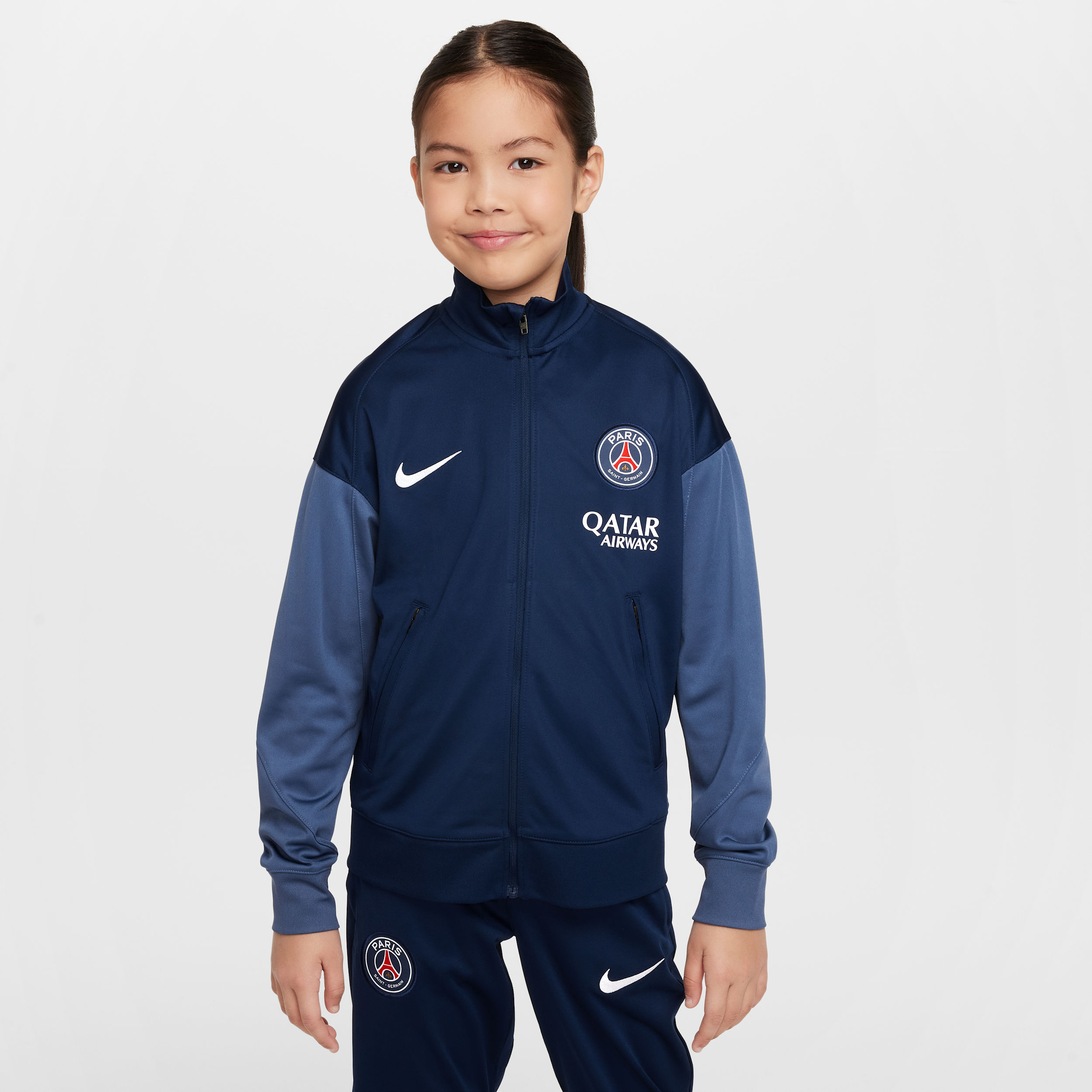 Thumbnail - Paris Saint-Germain Strike Nike Dri-FIT Fußball-Trainingsanzug aus Strickmaterial (ältere Kinder) - Blau