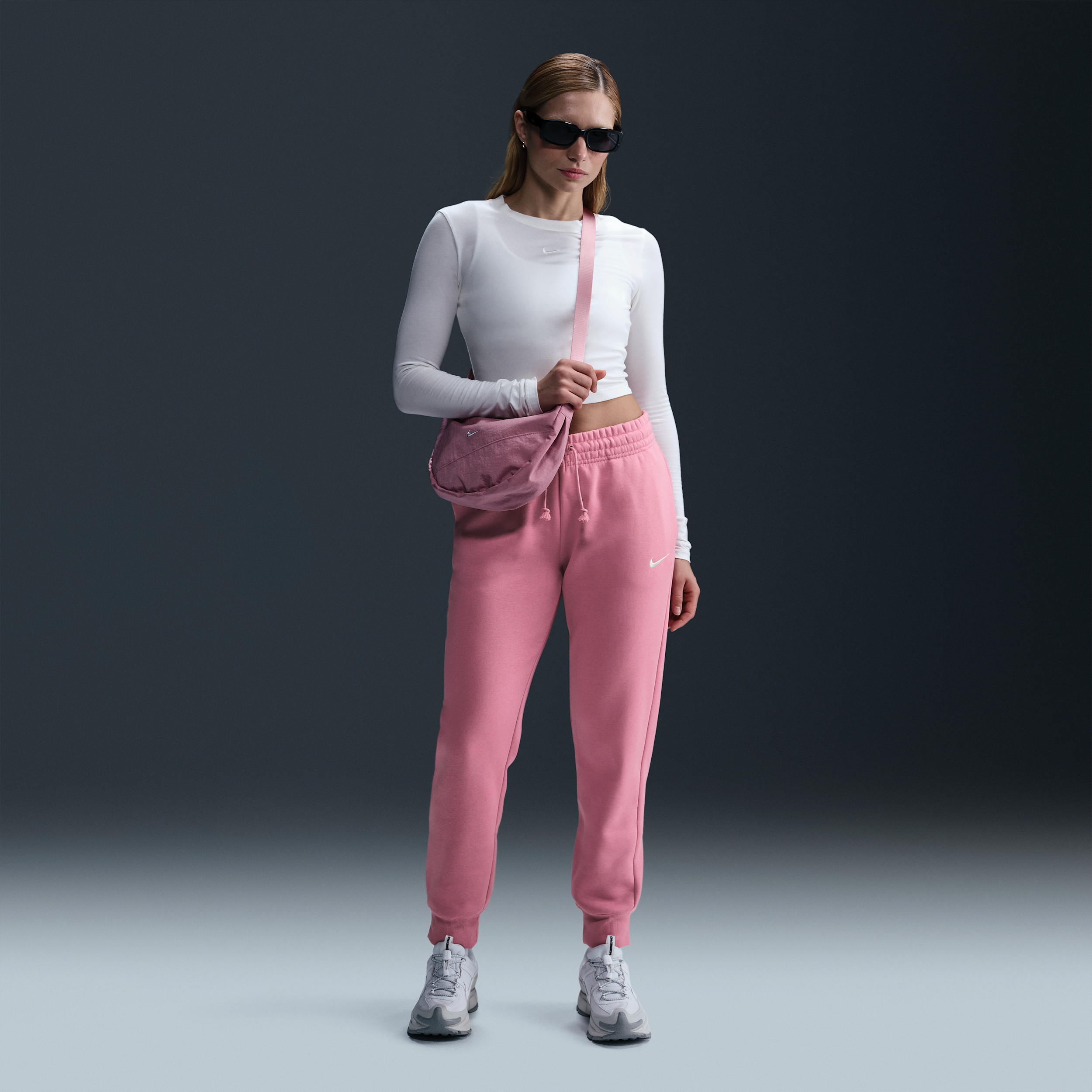 Pantalon de survêtement taille mi-haute Nike Sportswear Phoenix Fleece pour femme - Rose