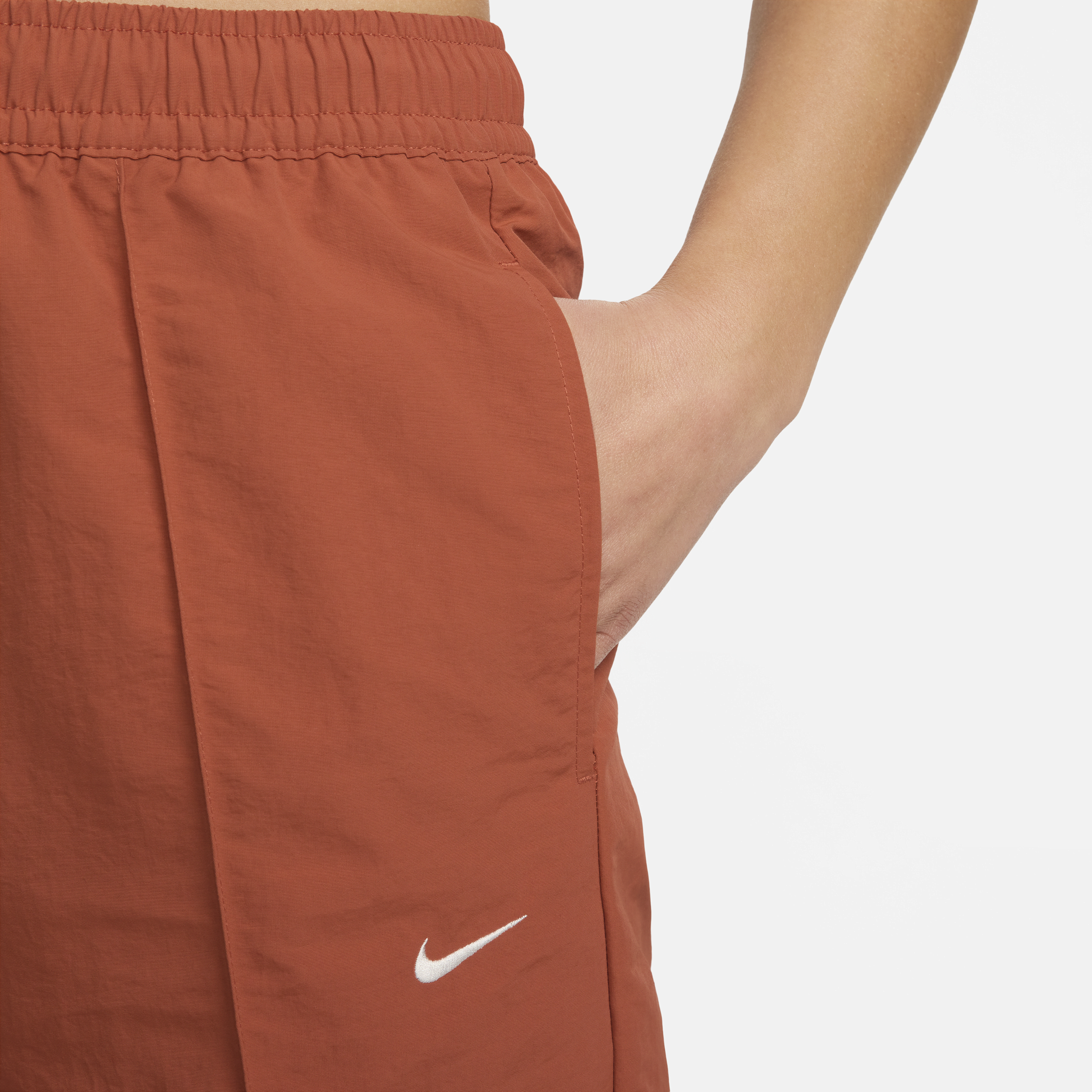 Nike Sportswear Everything Wovens damesbroek met halfhoge taille en open zoom Oranje
