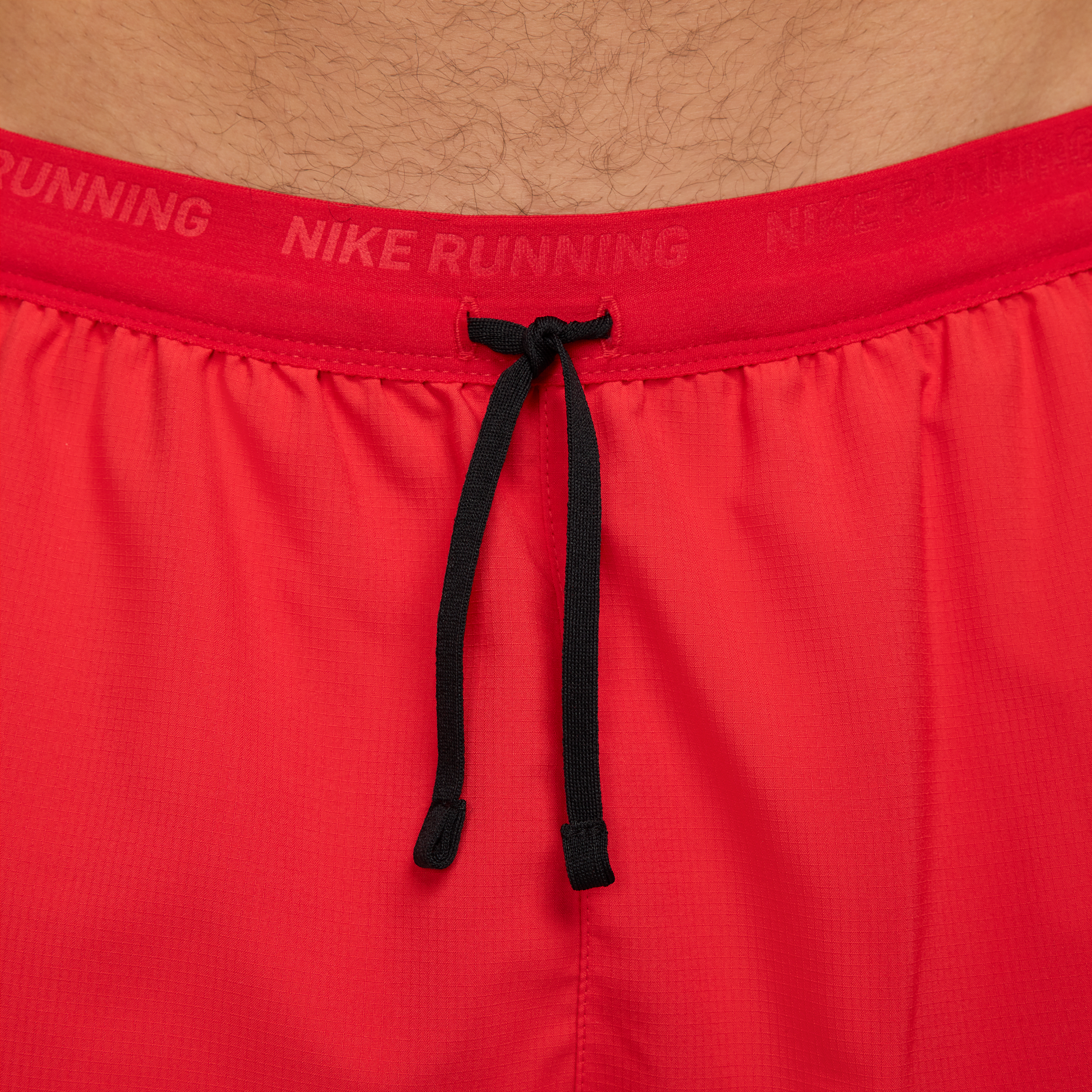 Short de running 2-en-1 18 cm Dri-FIT Nike Stride pour homme - Rouge