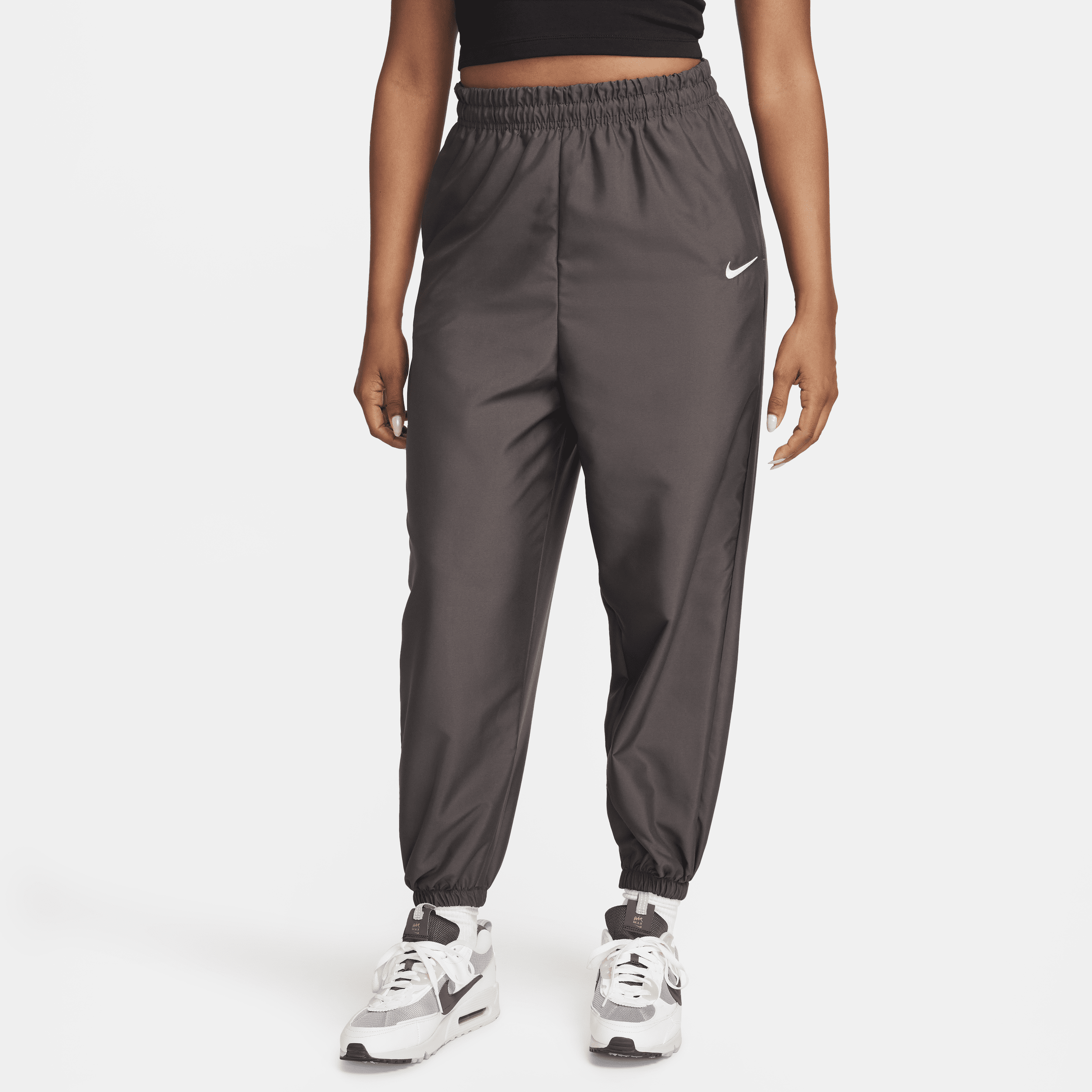 Nike Sportswear geweven joggingbroek voor dames Bruin